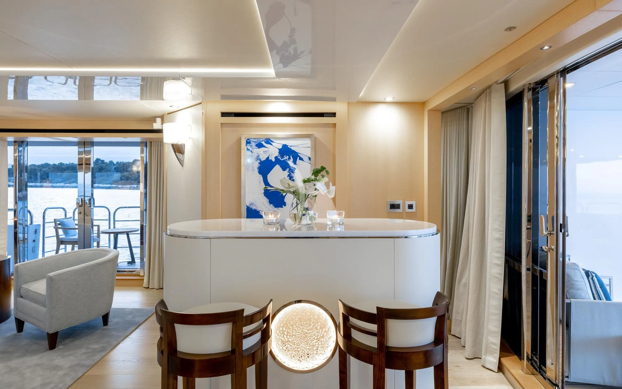 a room with a table chairs and a window aboard ARADOS Yacht for Charter