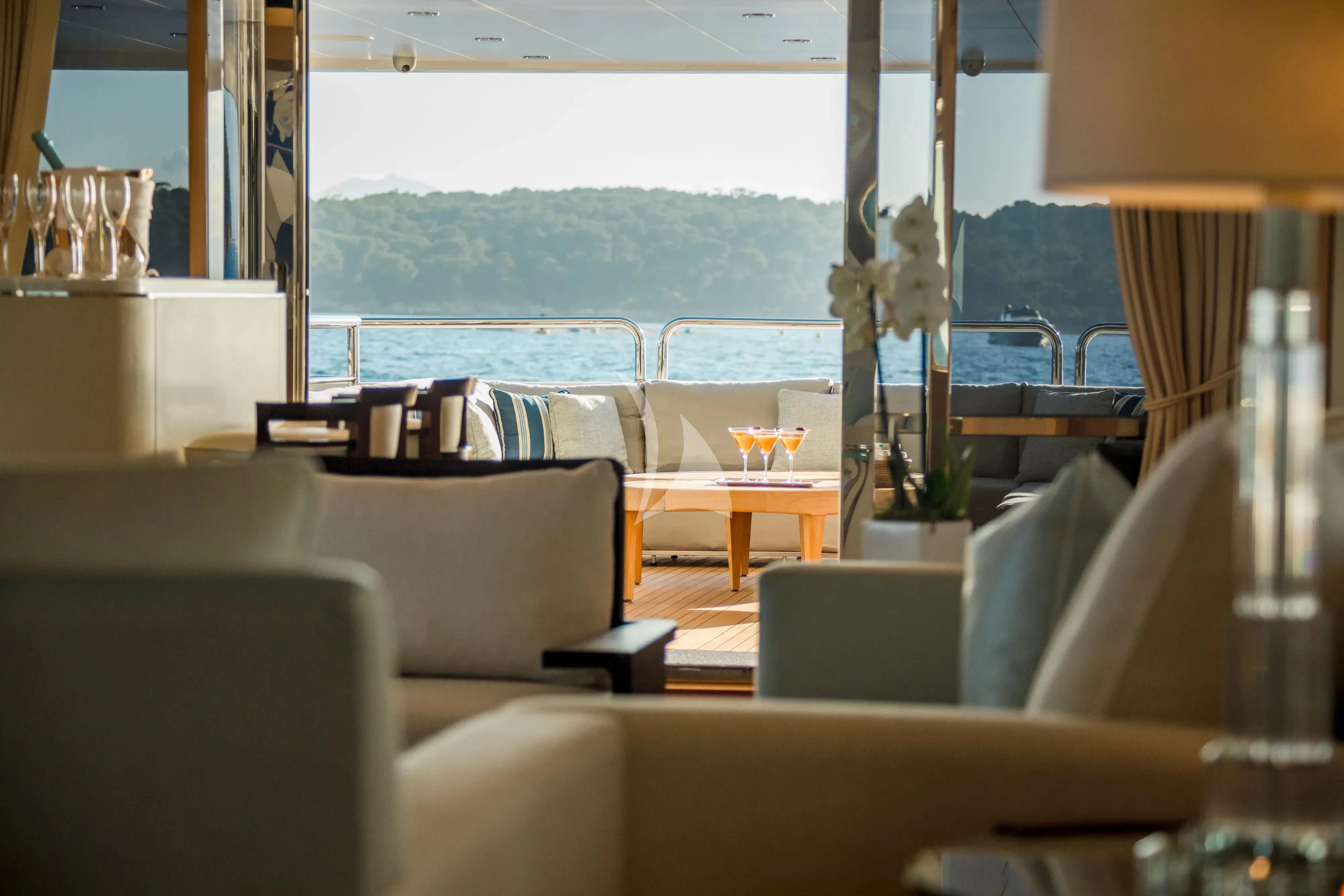 a room with couches and a table aboard ARADOS Yacht for Charter
