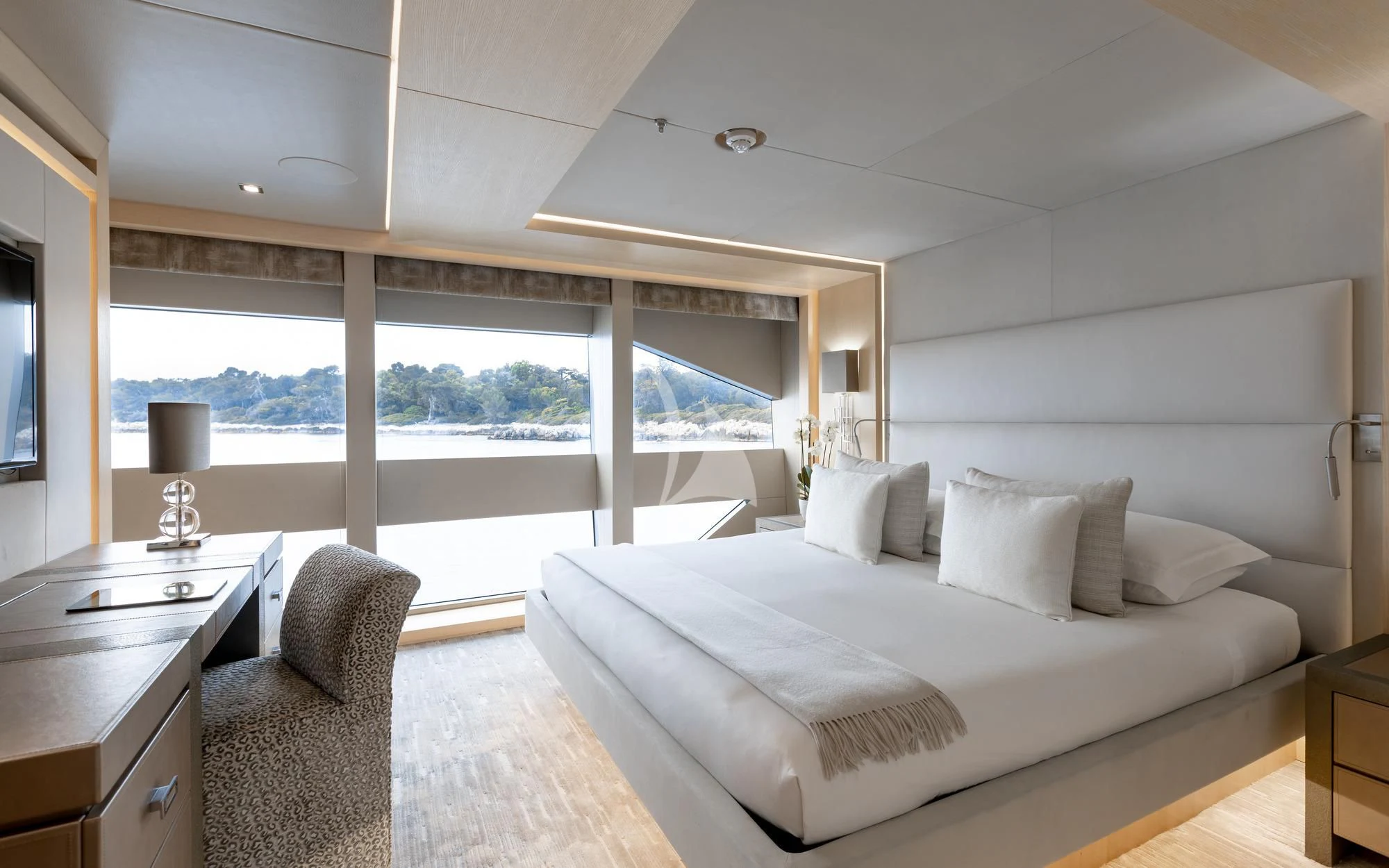 a large white bed in a room aboard ARADOS Yacht for Charter