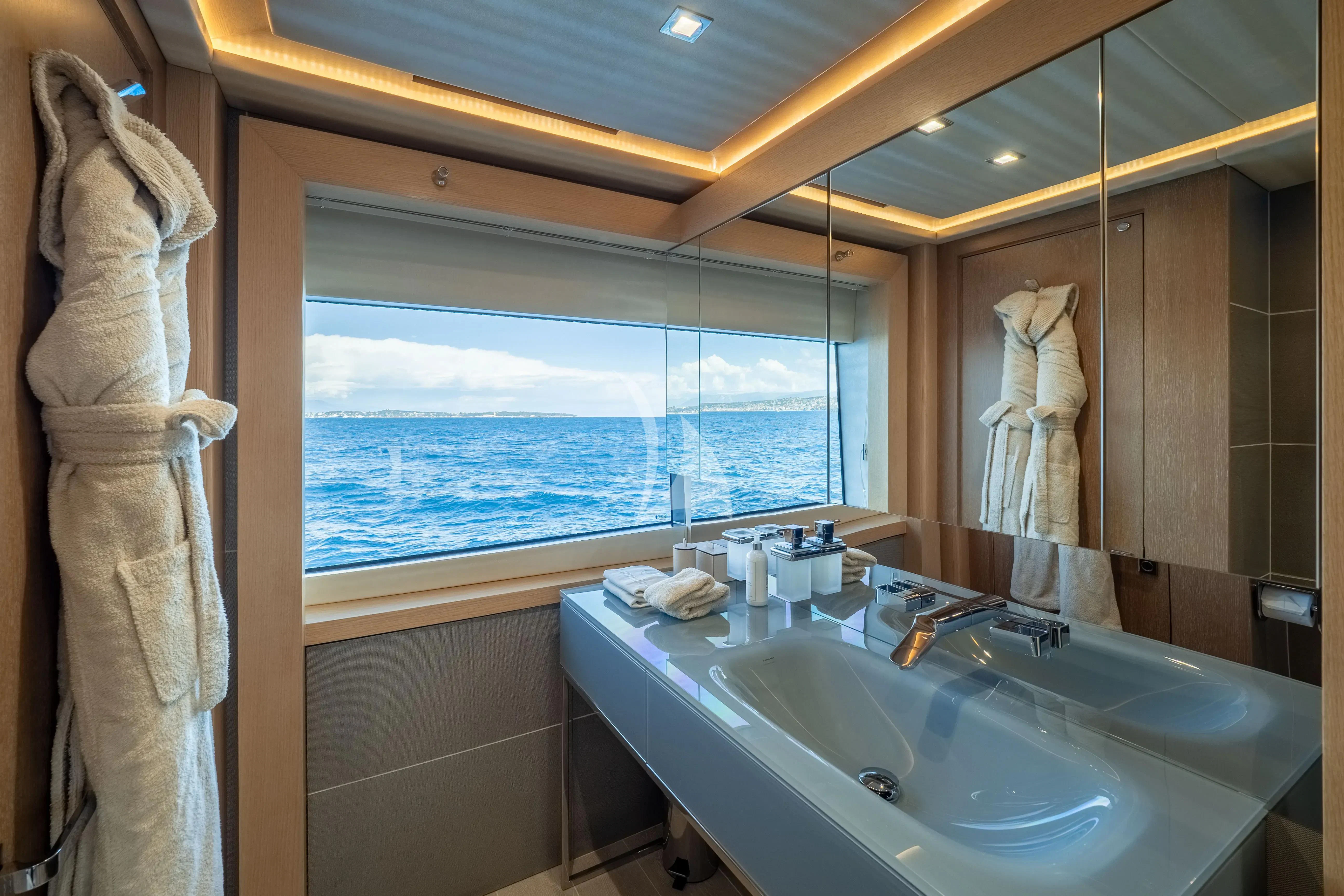a bathroom with a large window aboard ARADOS Yacht for Charter