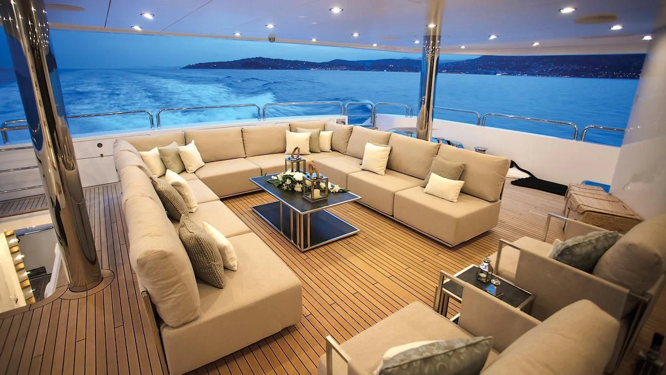 a living room with a couch and a table aboard ARADOS Yacht for Charter
