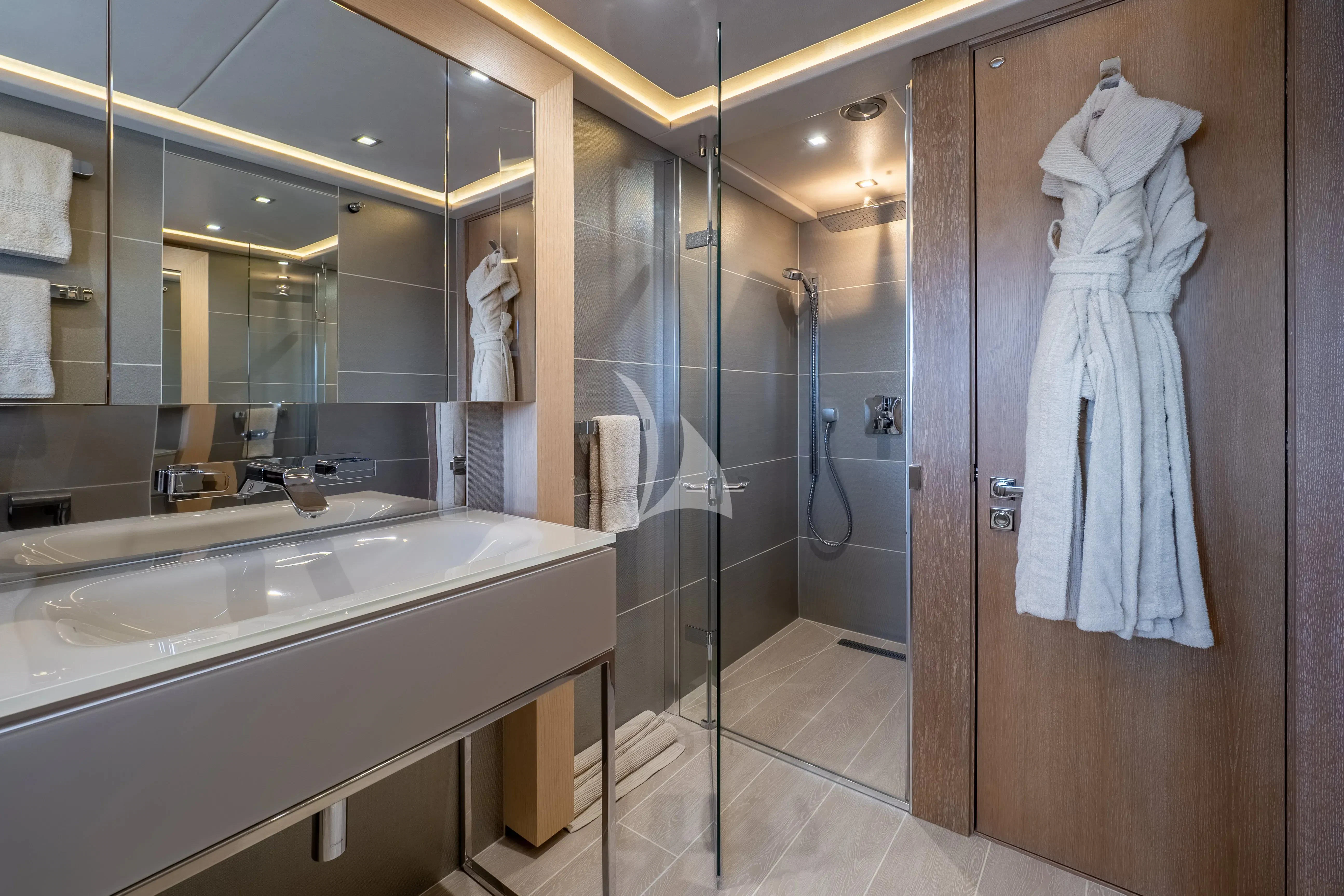 a bathroom with a large mirror aboard ARADOS Yacht for Charter