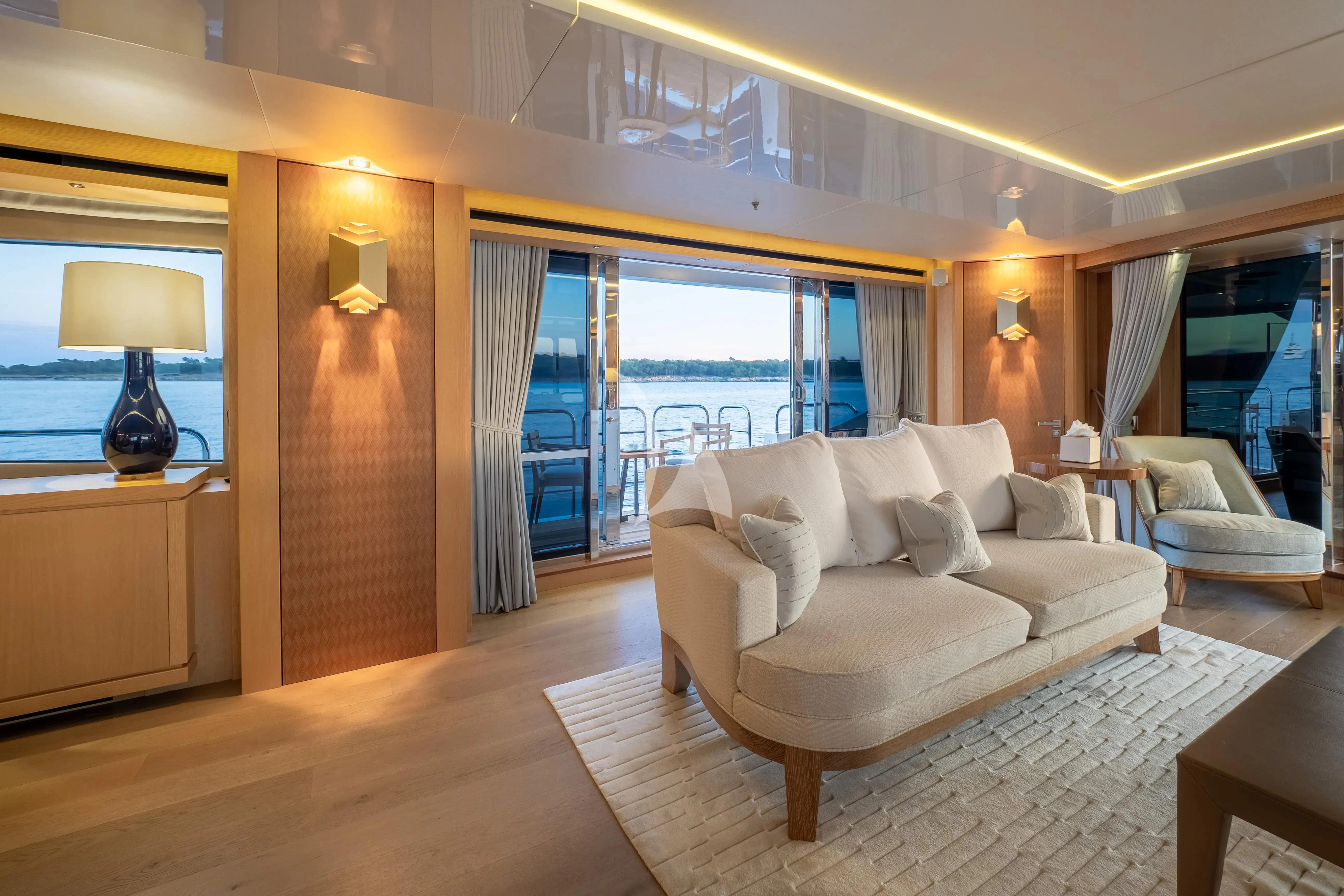 a living room with a large window aboard ARADOS Yacht for Charter