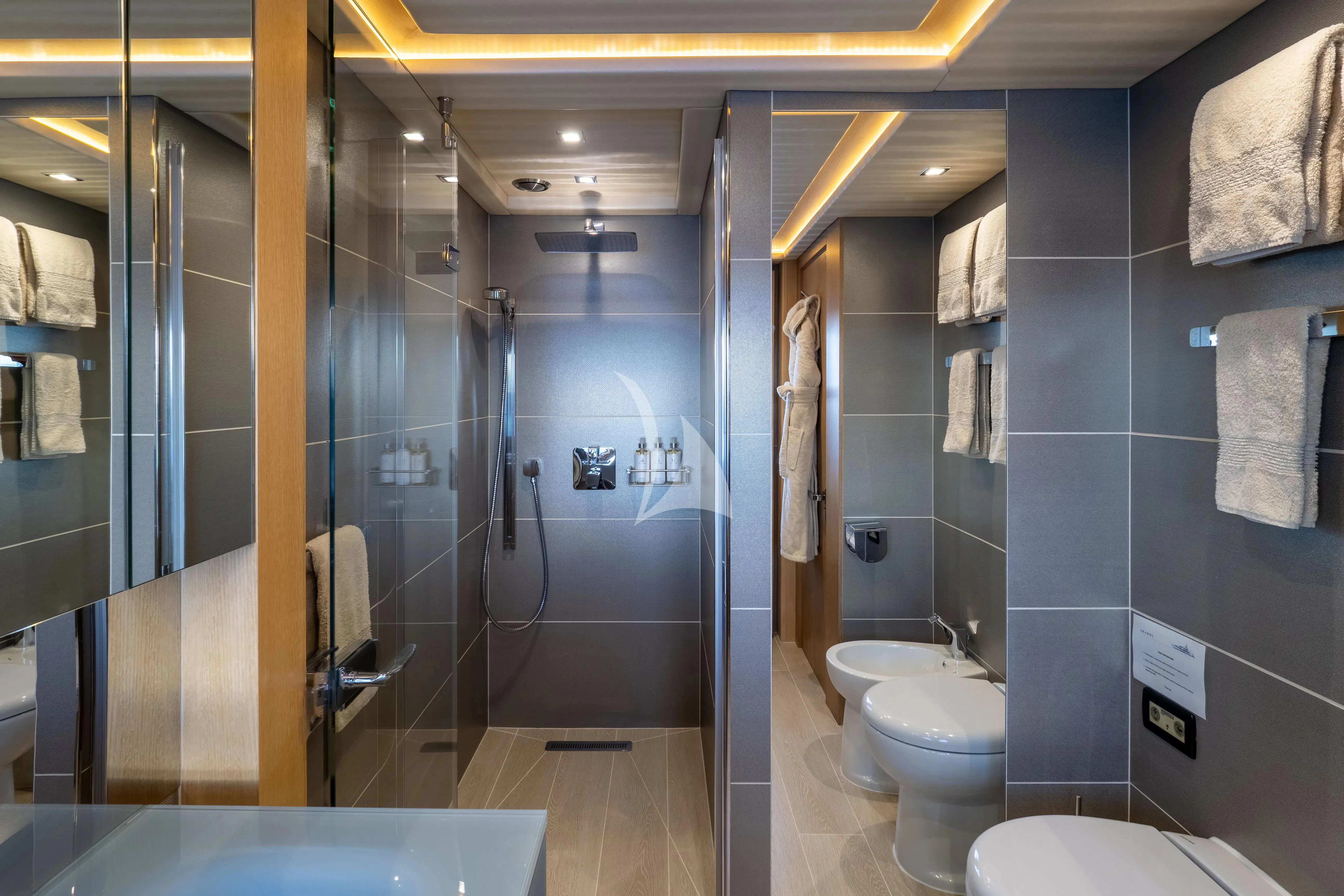 a bathroom with a glass shower aboard ARADOS Yacht for Charter