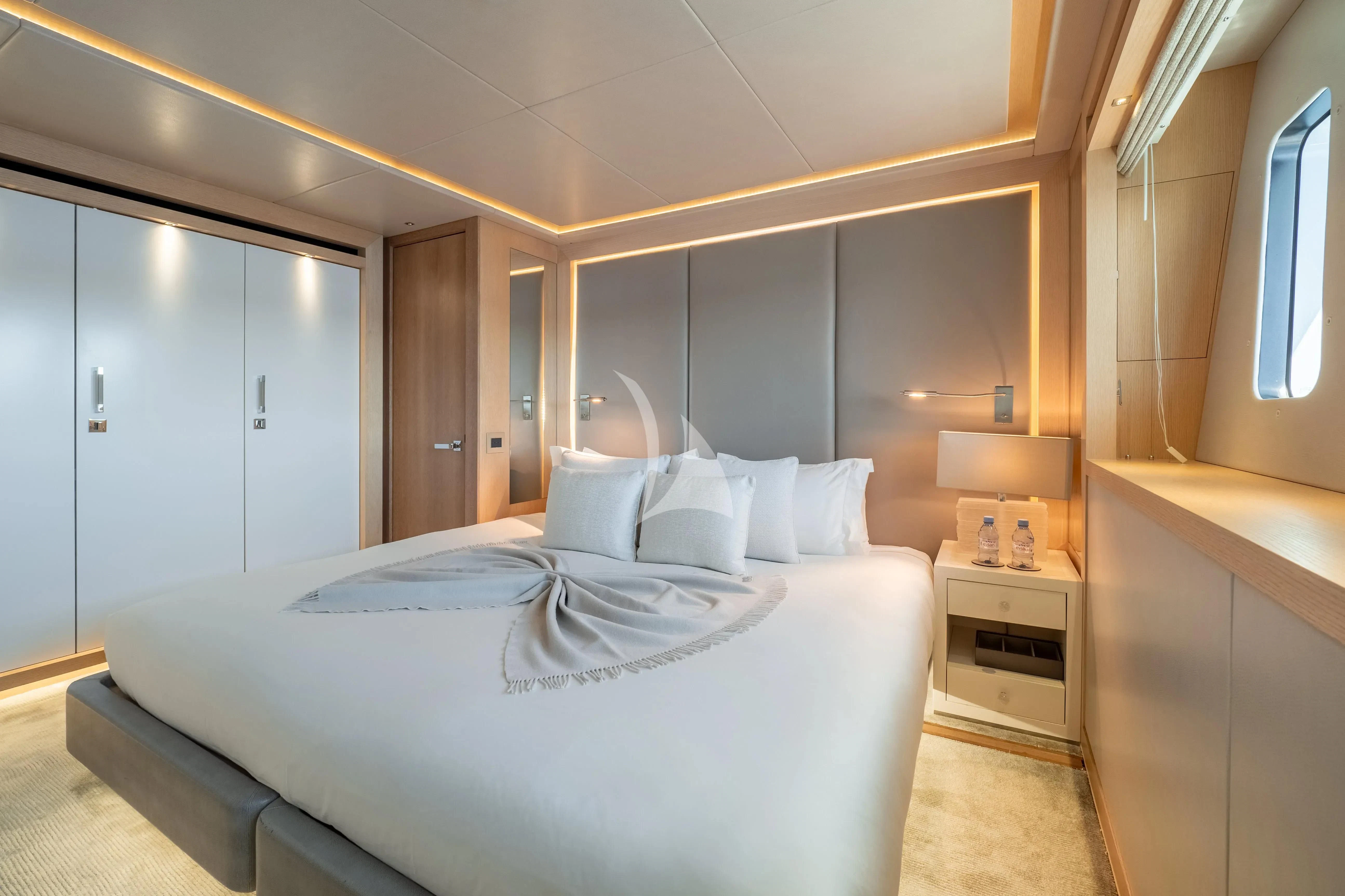 a large white bed in a room aboard ARADOS Yacht for Charter
