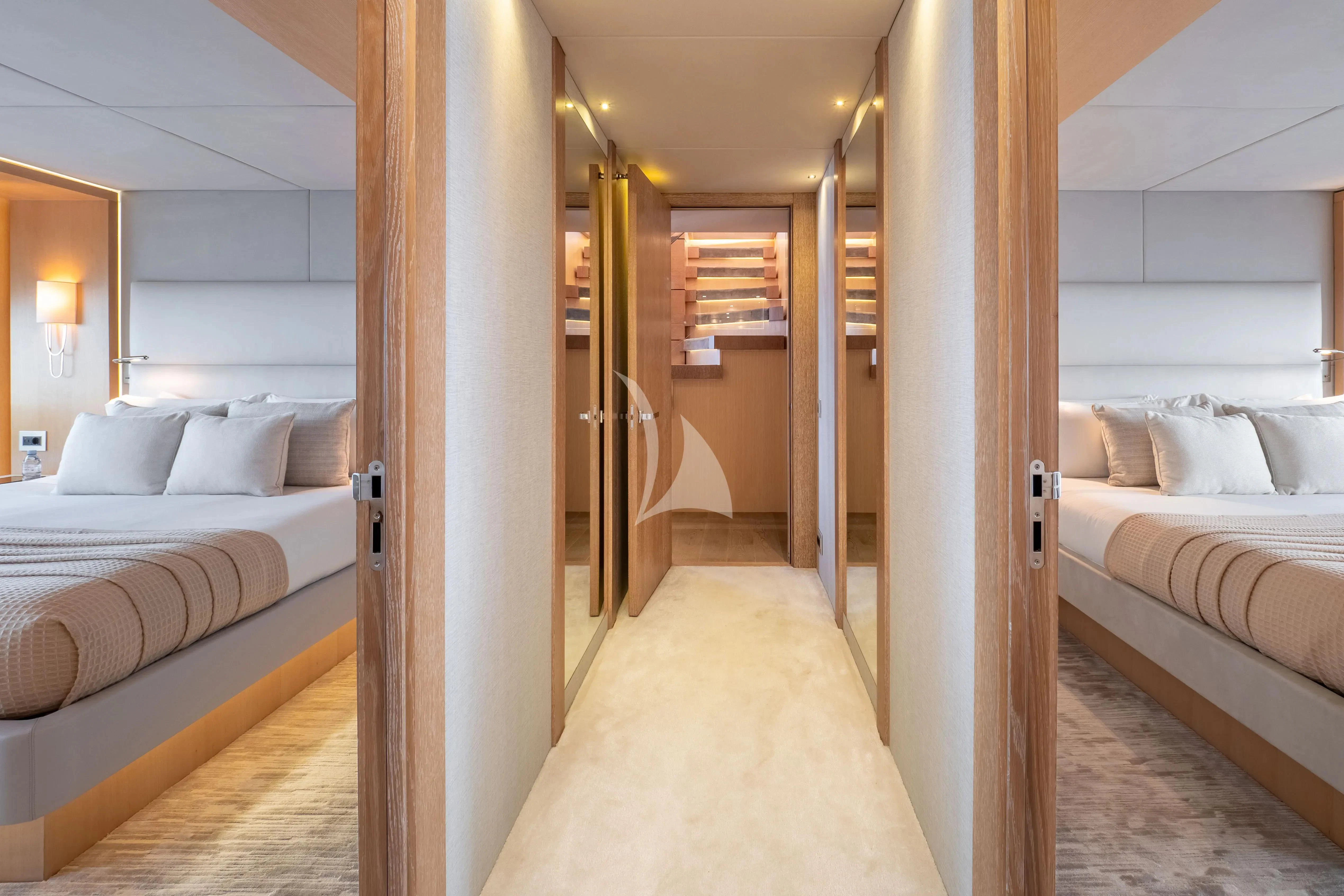 a room with a bed and a mirror aboard ARADOS Yacht for Charter