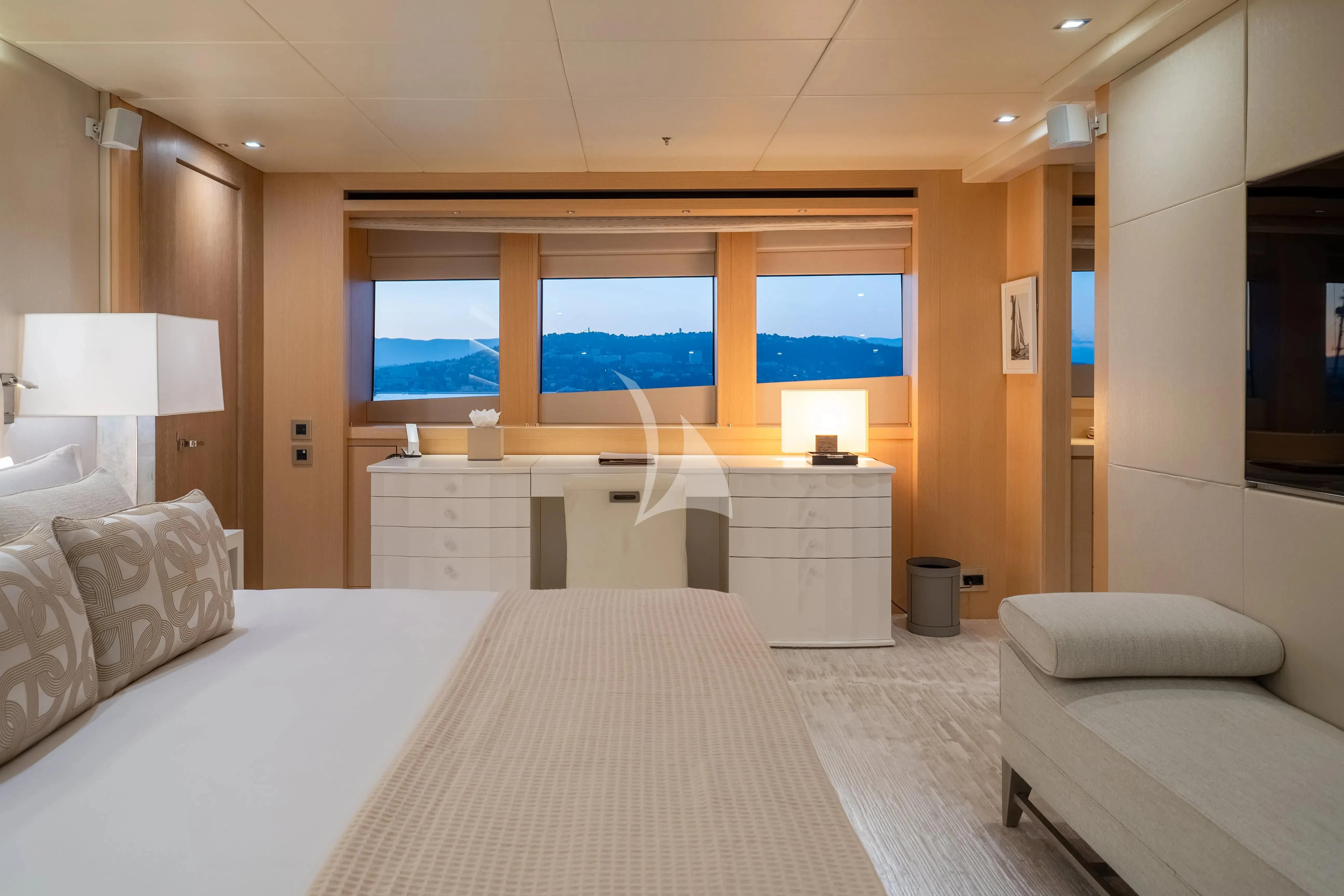 a room with a bed and a couch aboard ARADOS Yacht for Charter