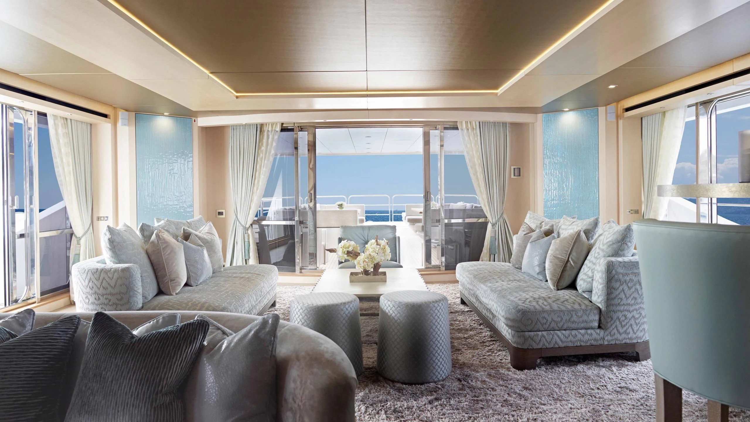 a living room with a large window aboard ARADOS Yacht for Charter
