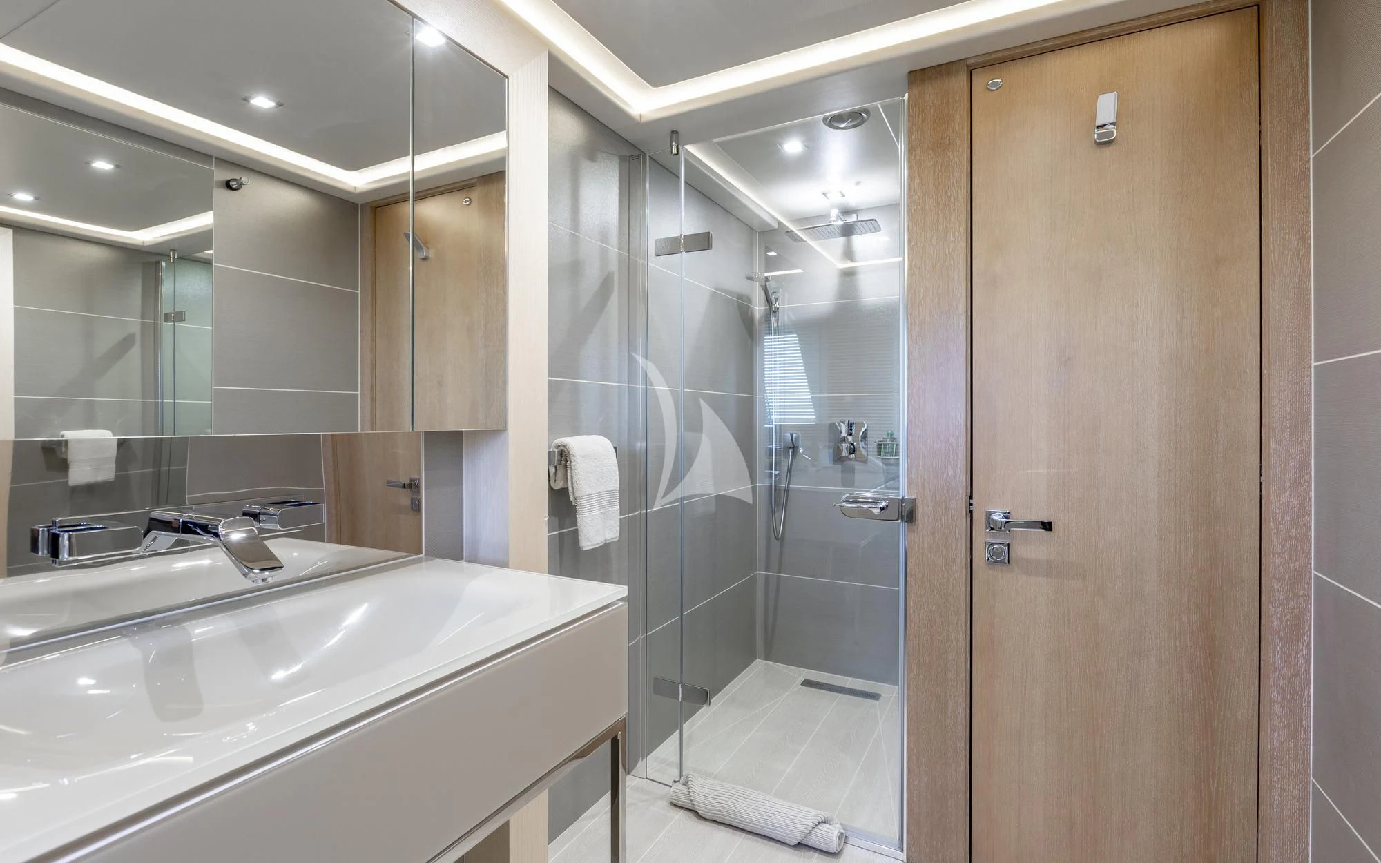 a bathroom with a glass shower aboard ARADOS Yacht for Charter