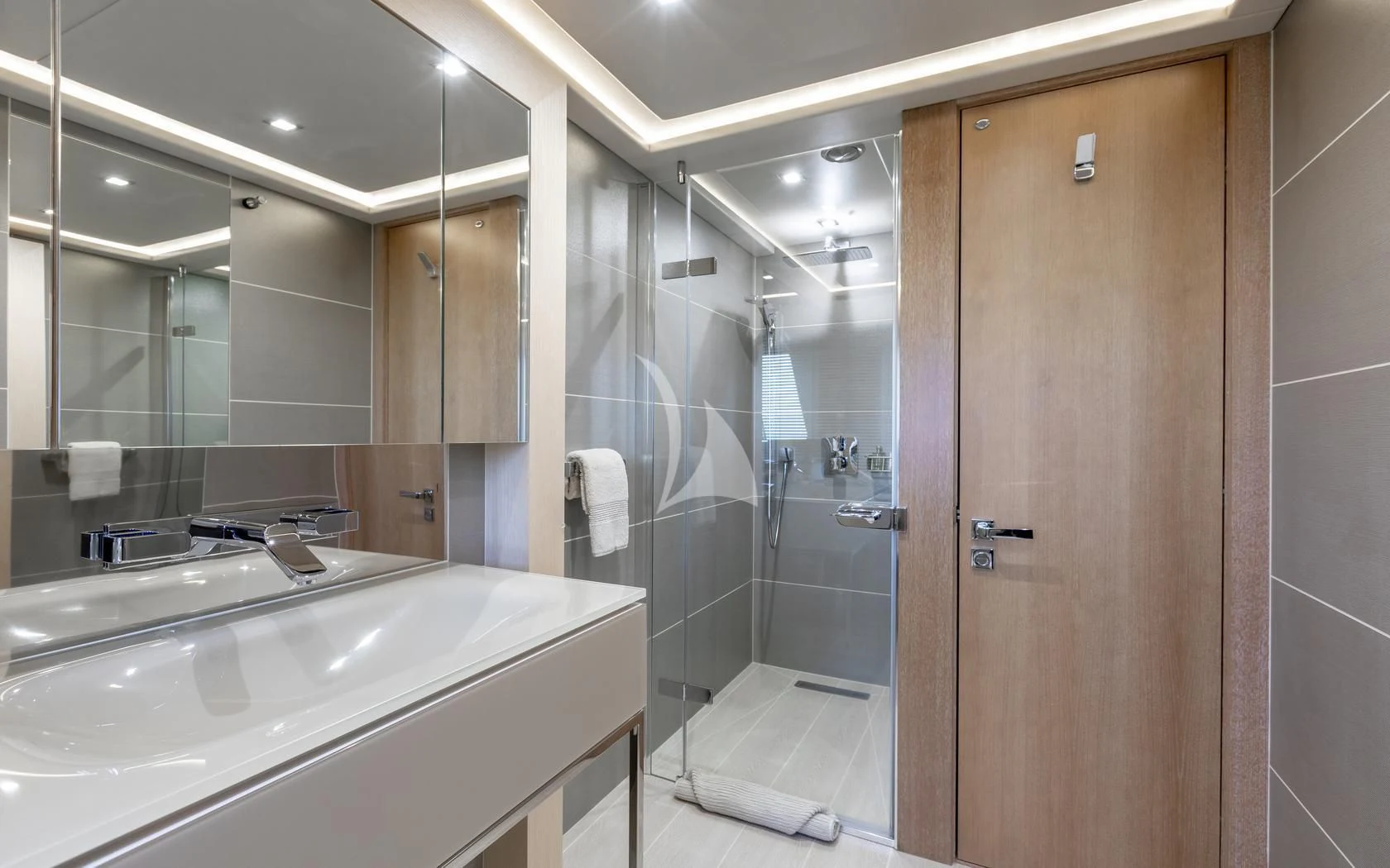 a bathroom with a glass shower aboard ARADOS Yacht for Charter