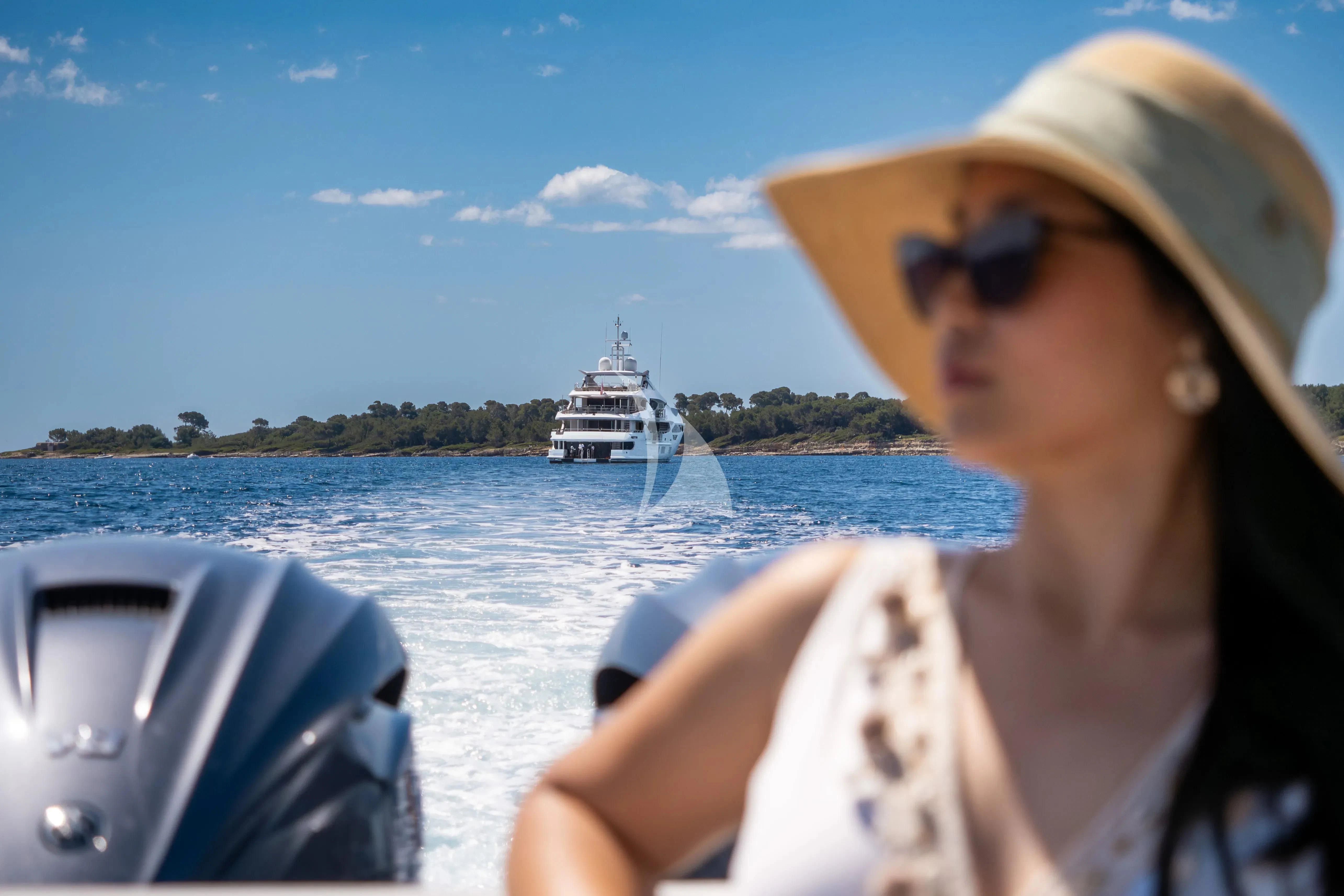 a person driving a boat aboard ARADOS Yacht for Charter
