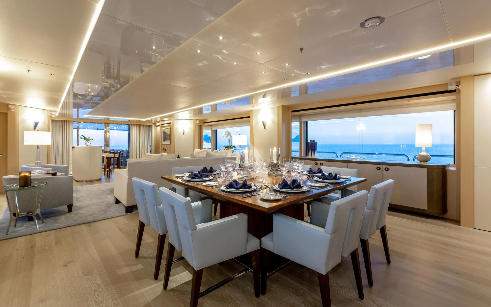 a large dining room with a large table and chairs aboard ARADOS Yacht for Charter