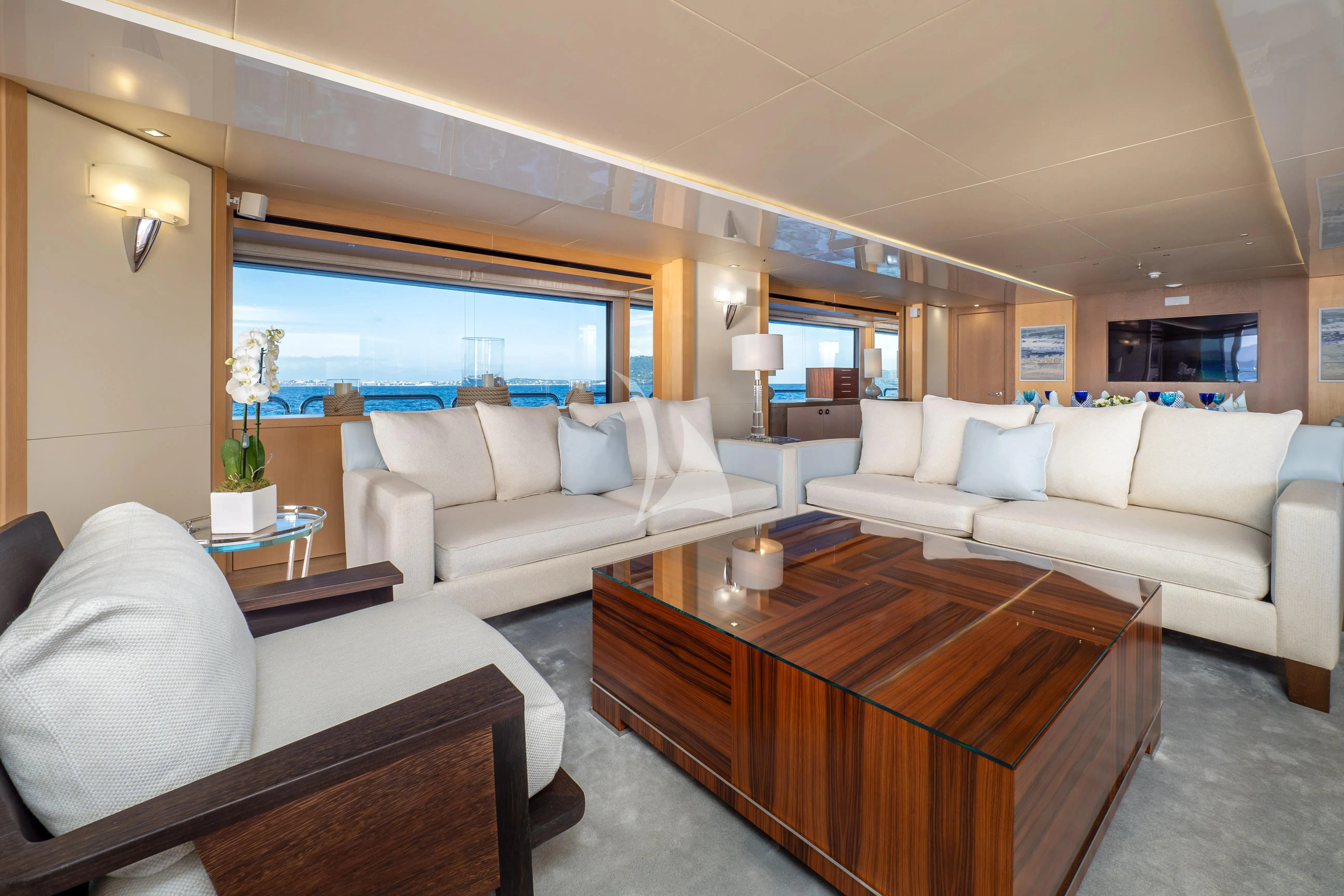 a living room with a large window aboard ARADOS Yacht for Charter