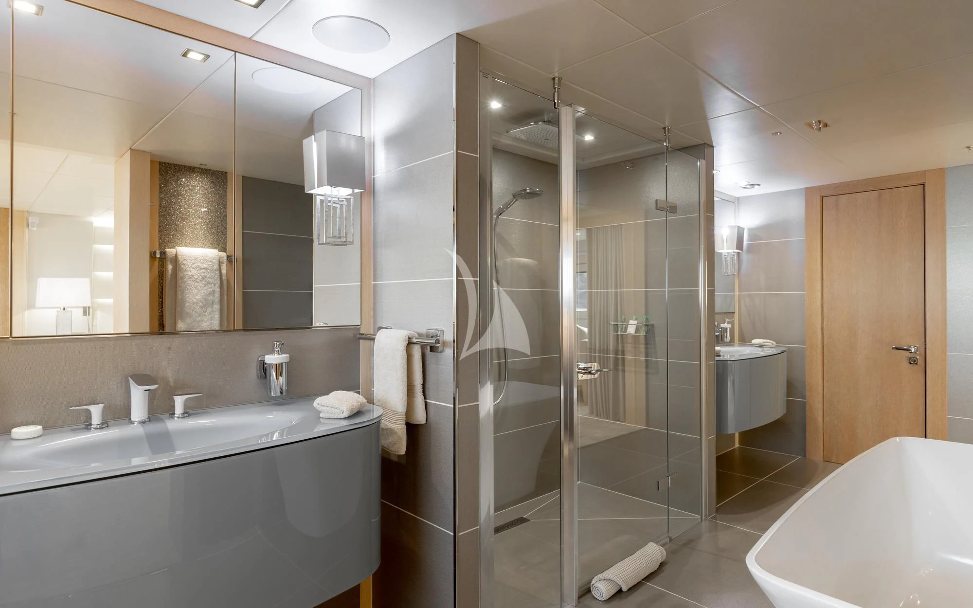 a bathroom with a glass shower aboard ARADOS Yacht for Charter
