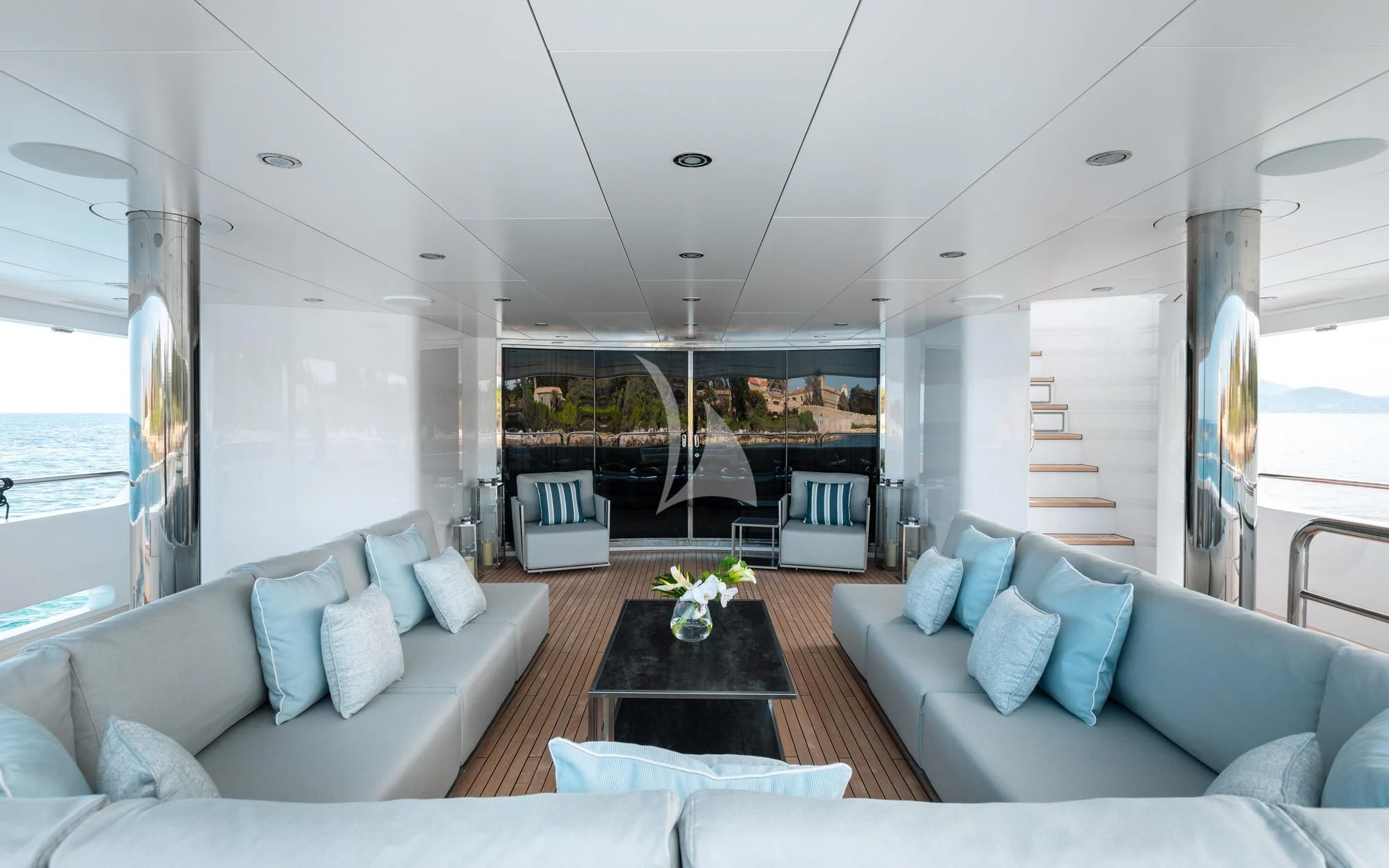 a living room with a large window aboard ARADOS Yacht for Charter
