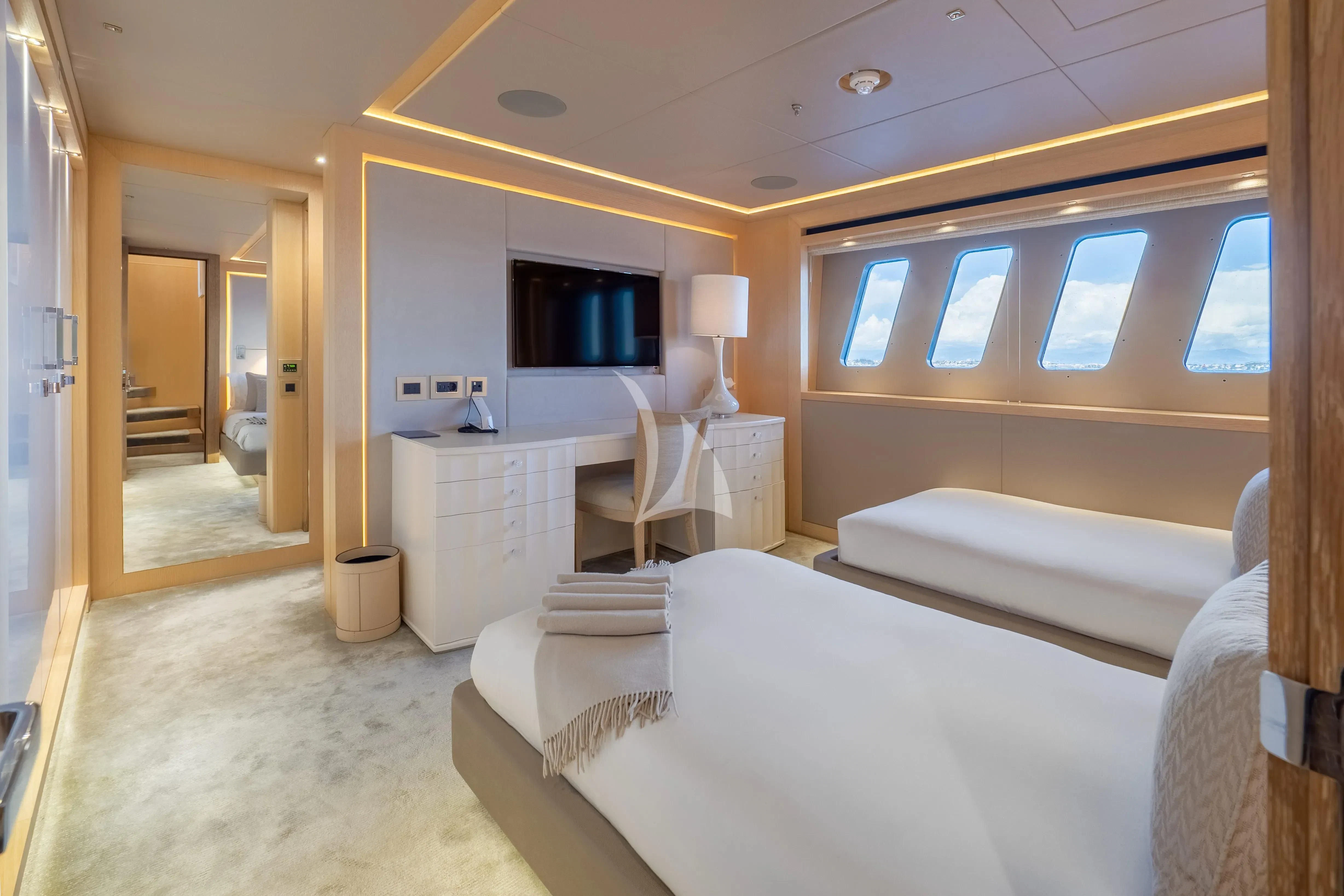 a room with a bed and a mirror aboard ARADOS Yacht for Charter