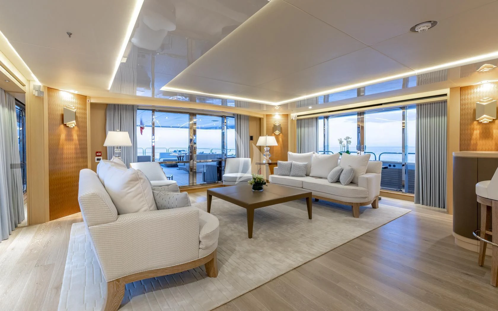 a living room with a large window aboard ARADOS Yacht for Charter
