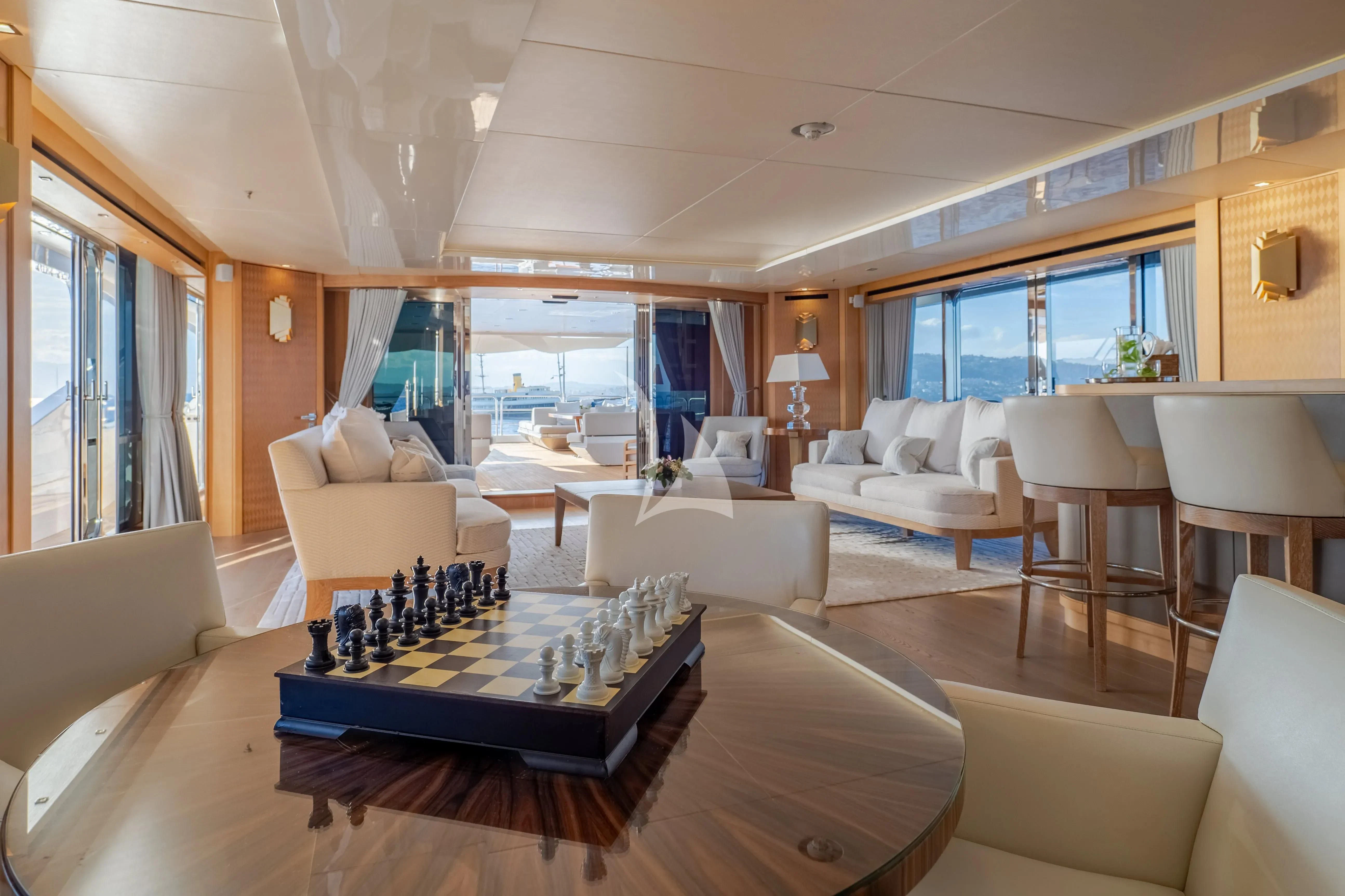 a living room with a large window aboard ARADOS Yacht for Charter