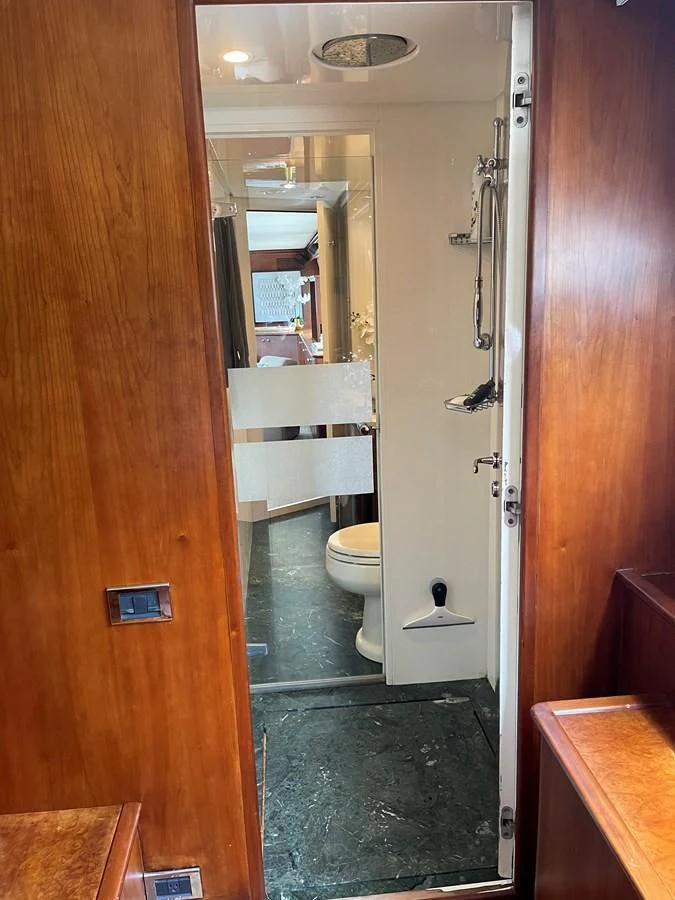 a bathroom with a shower and toilet aboard REFLECTION Yacht for Sale