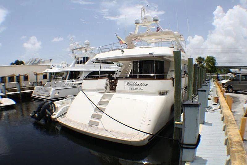 a boat docked at a pier aboard REFLECTION Yacht for Sale