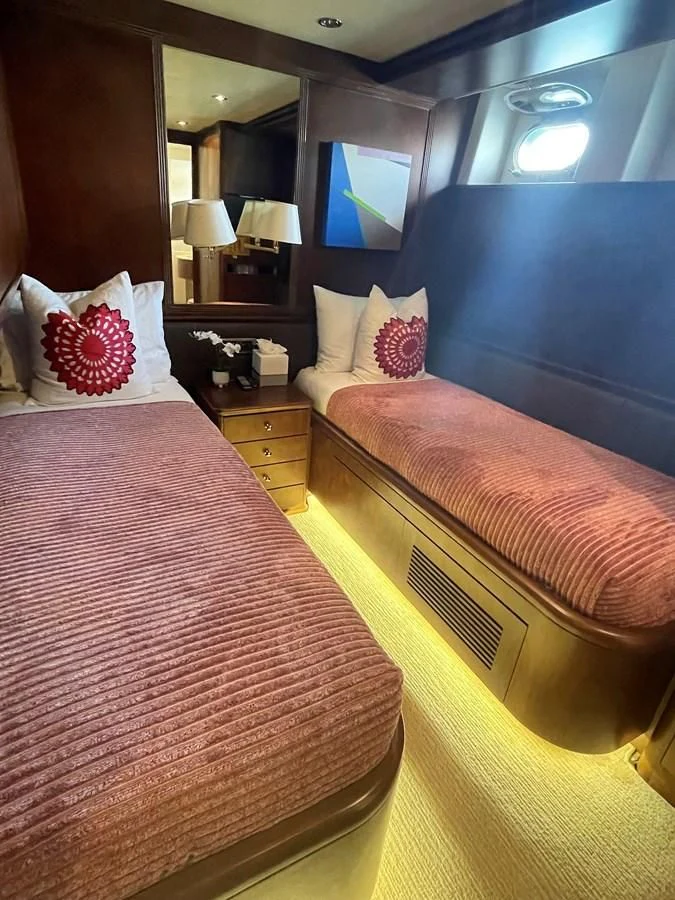 a hotel room with two beds aboard REFLECTION Yacht for Sale