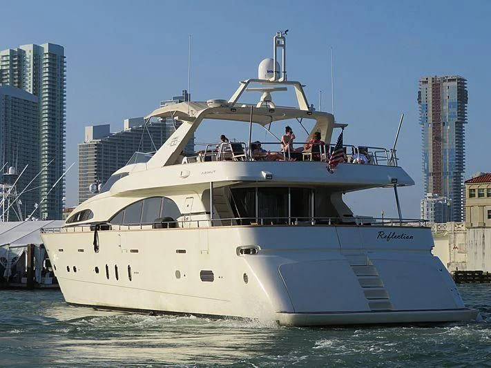 a boat with people on it aboard REFLECTION Yacht for Sale