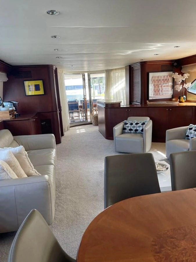a living room with a large window aboard REFLECTION Yacht for Sale