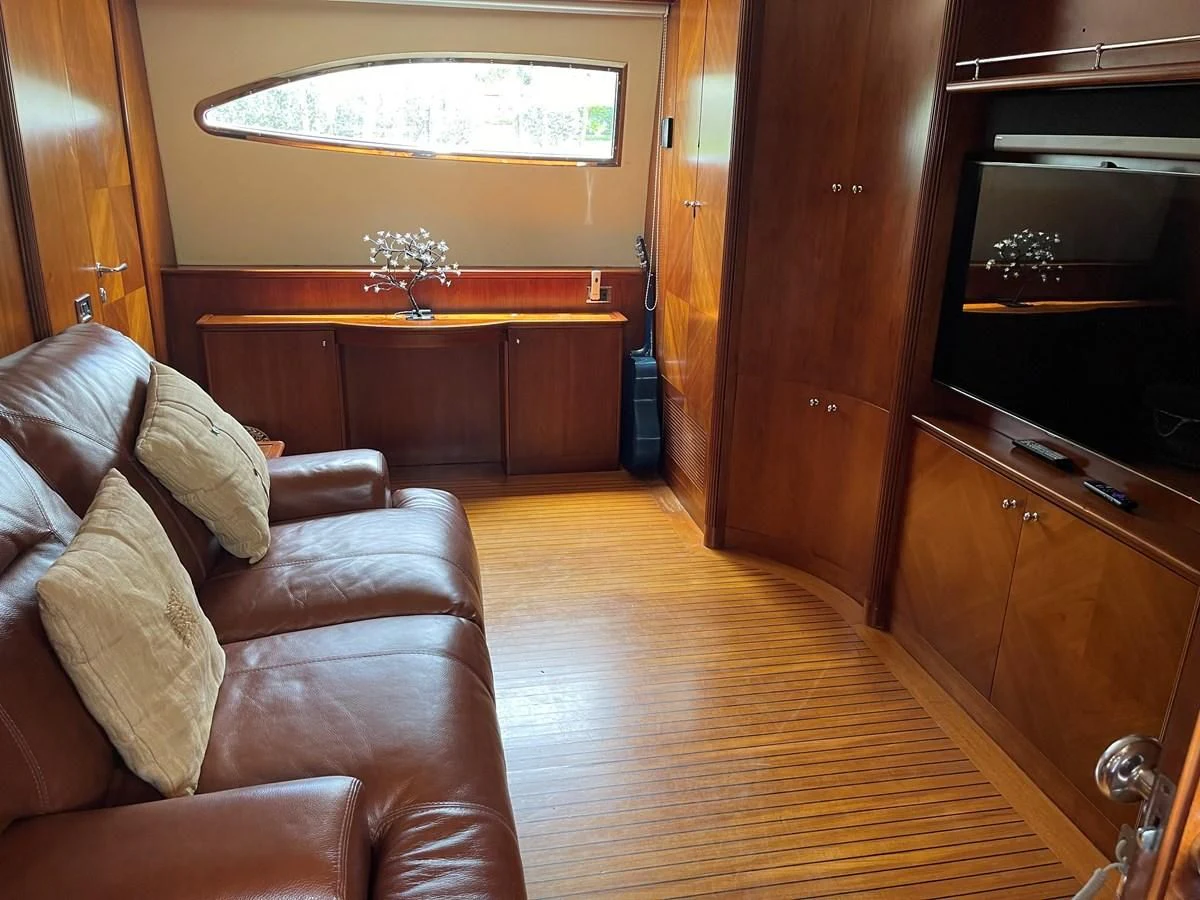 a living room with a wood floor aboard REFLECTION Yacht for Sale