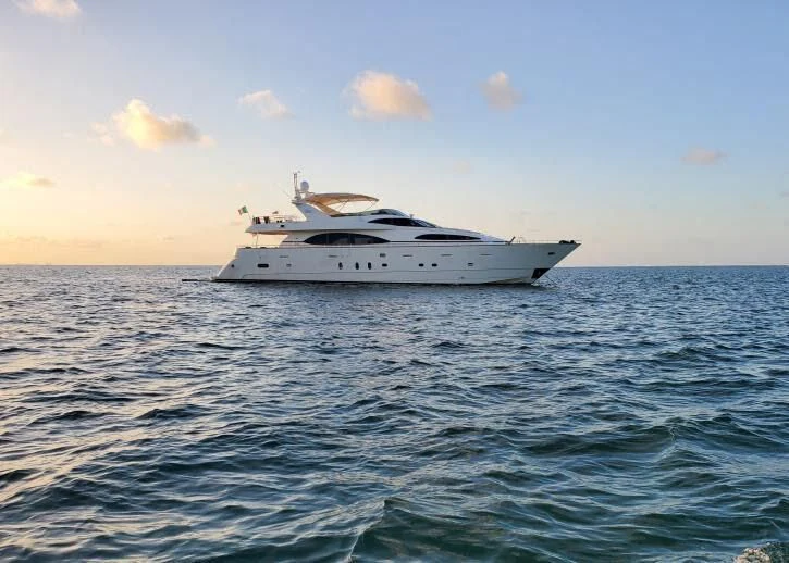 a white boat in the water aboard REFLECTION Yacht for Sale