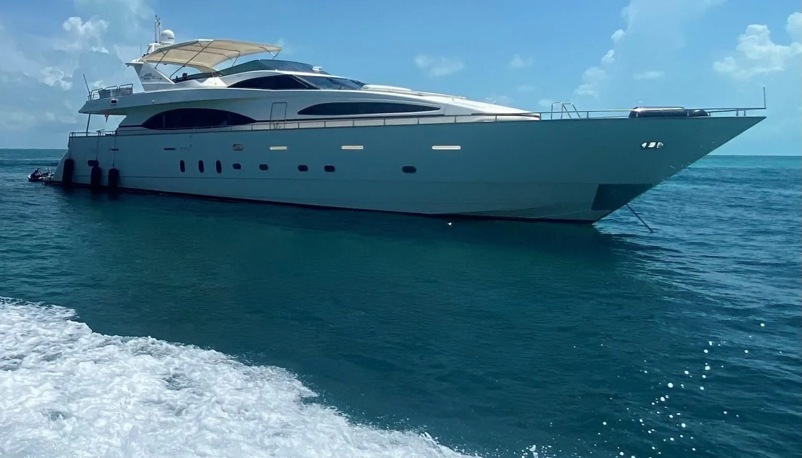 a yacht on the water aboard REFLECTION Yacht for Sale