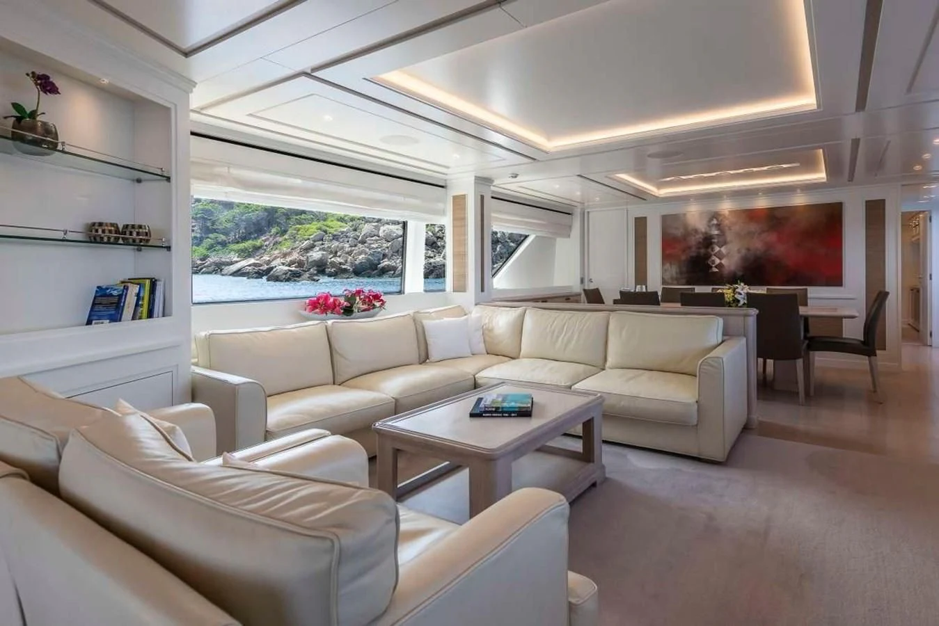 a living room with a couch and a table aboard 2011 SANLORENZO SD92 FLYBRIDGE Yacht for Sale