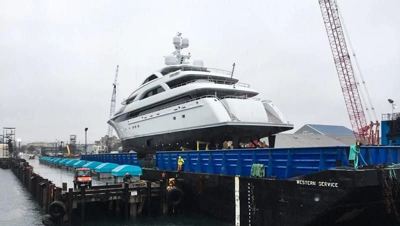 a large cruise ship docked aboard SATORI Yacht for Sale