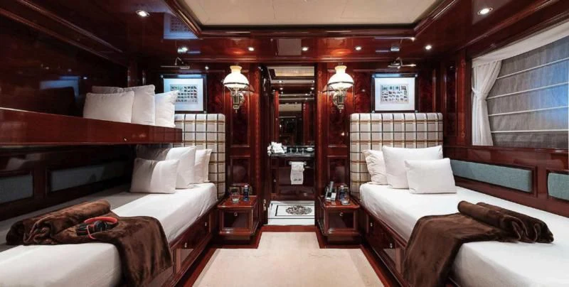 a room with a bed and a couch aboard BEOL Yacht for Sale