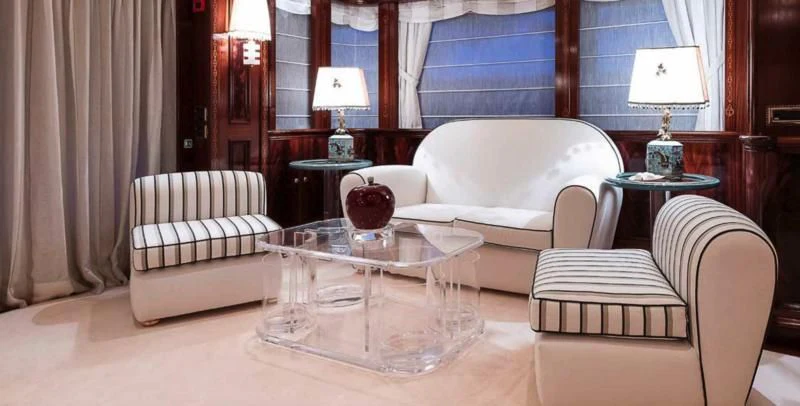 a living room with a couch and a coffee table aboard BEOL Yacht for Sale
