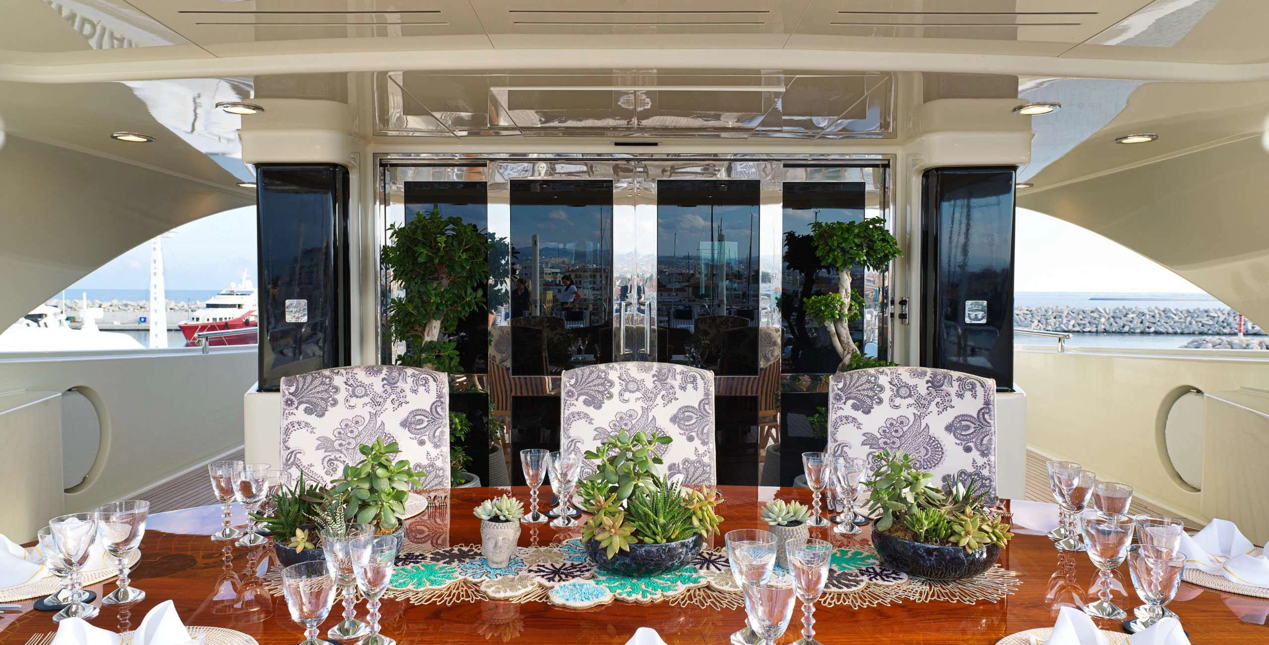 a table with glasses and plants aboard BEOL Yacht for Sale