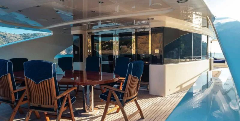 a room with a table and chairs aboard BEOL Yacht for Sale