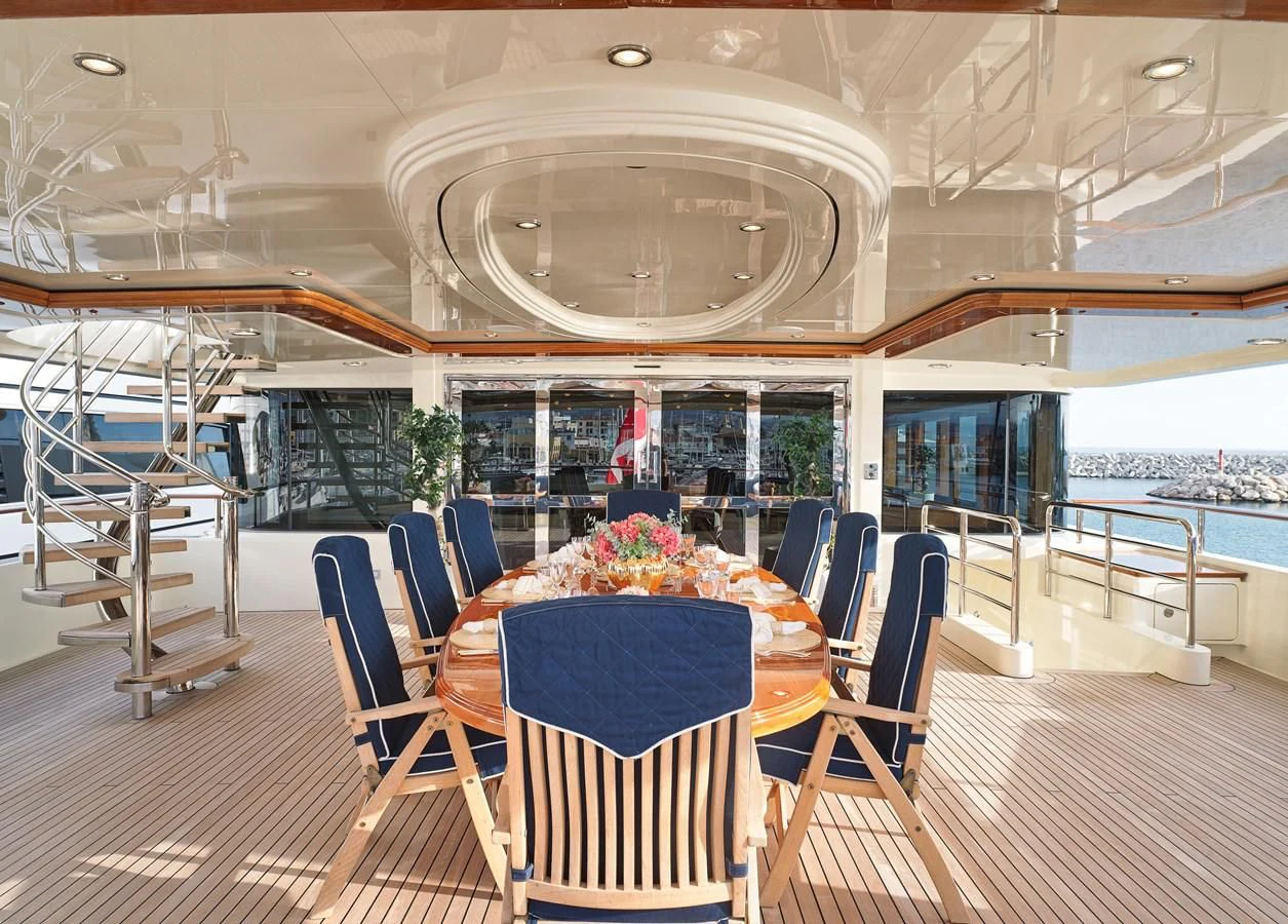 a room with a table and chairs aboard BEOL Yacht for Sale