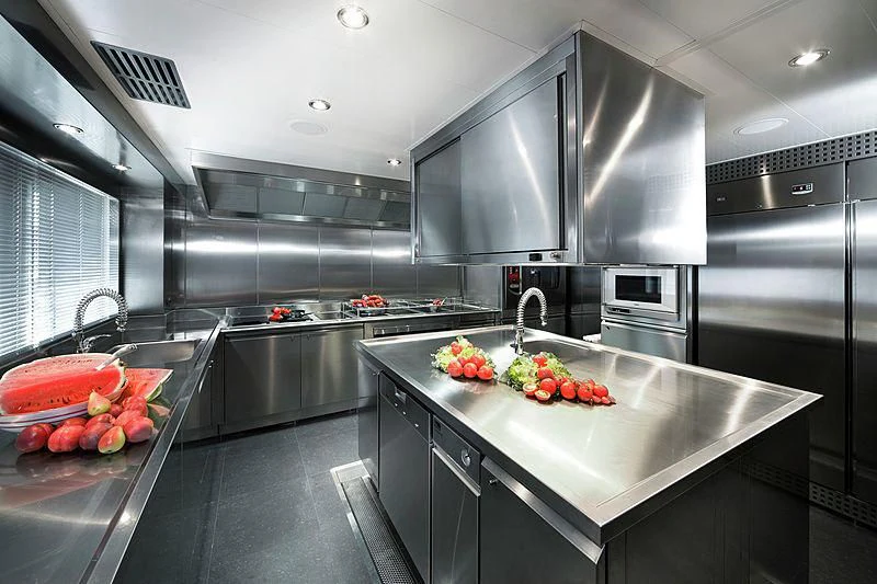 a kitchen with stainless steel appliances aboard BEOL Yacht for Sale