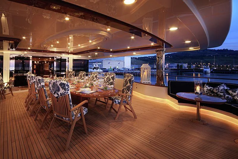 a room with tables and chairs aboard BEOL Yacht for Sale