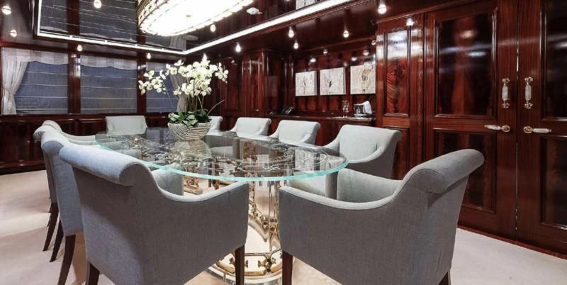 a room with a table and chairs aboard BEOL Yacht for Sale