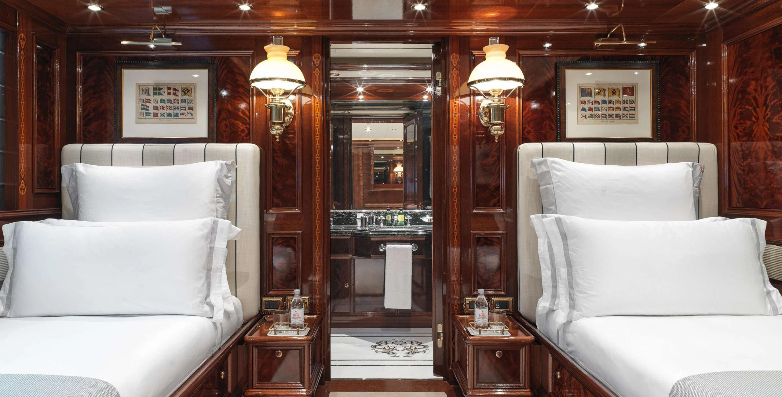 a room with a bed and a mirror aboard BEOL Yacht for Sale
