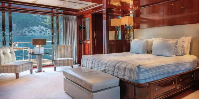a large bed in a room aboard BEOL Yacht for Sale