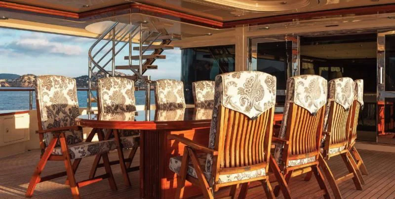 a group of chairs and tables aboard BEOL Yacht for Sale