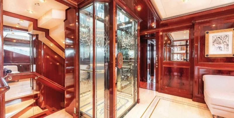 a room with wooden walls and a glass door aboard BEOL Yacht for Sale