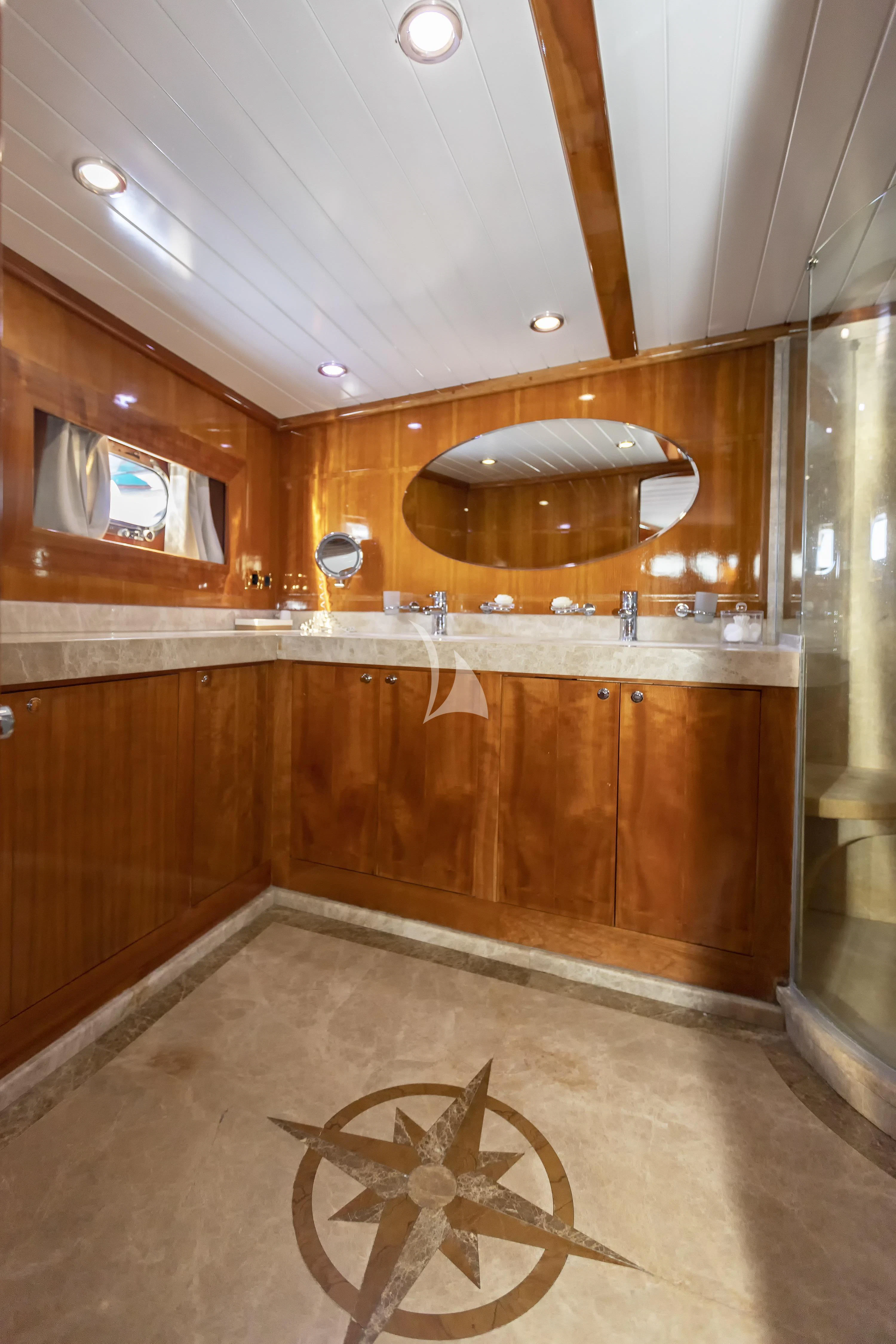 a bathroom with a large mirror aboard SILVER MOON Yacht for Sale