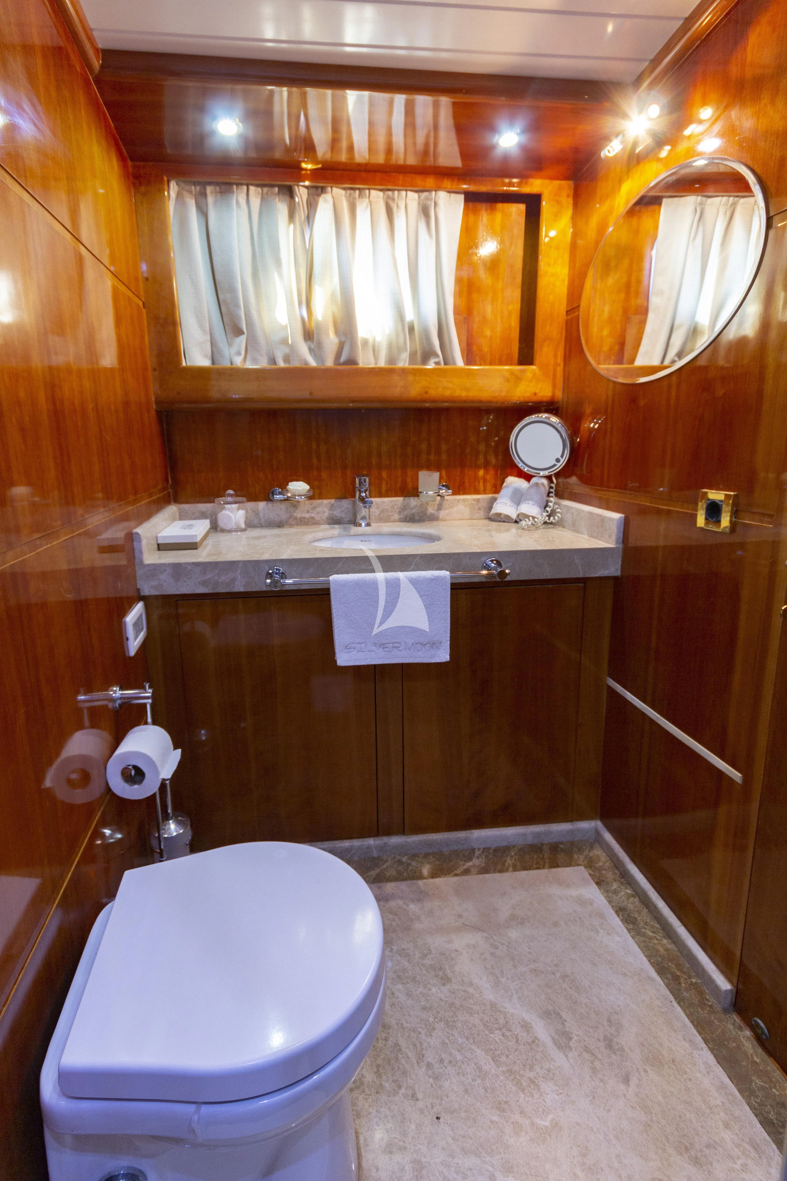 a bathroom with a sink and a toilet aboard SILVER MOON Yacht for Sale