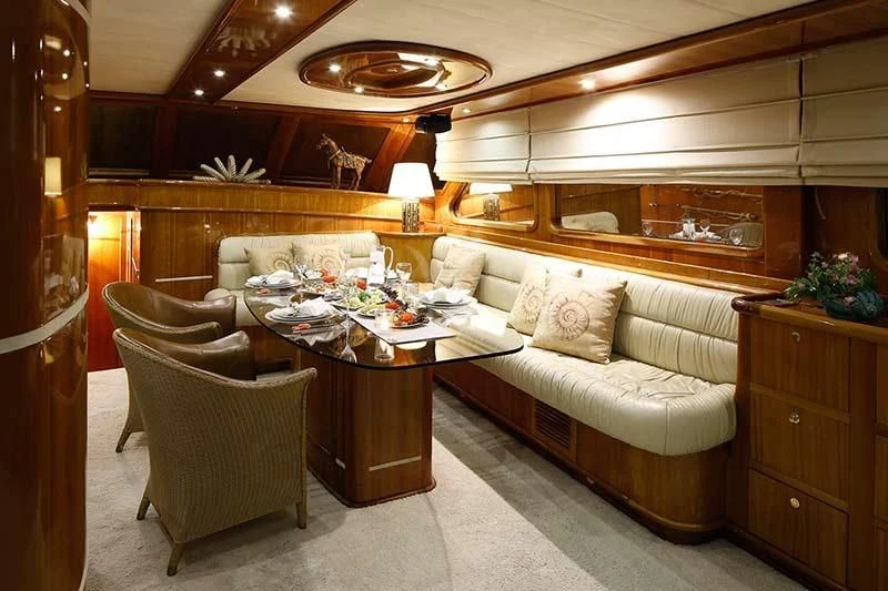 a living room with a couch and a table aboard SILVER MOON Yacht for Sale