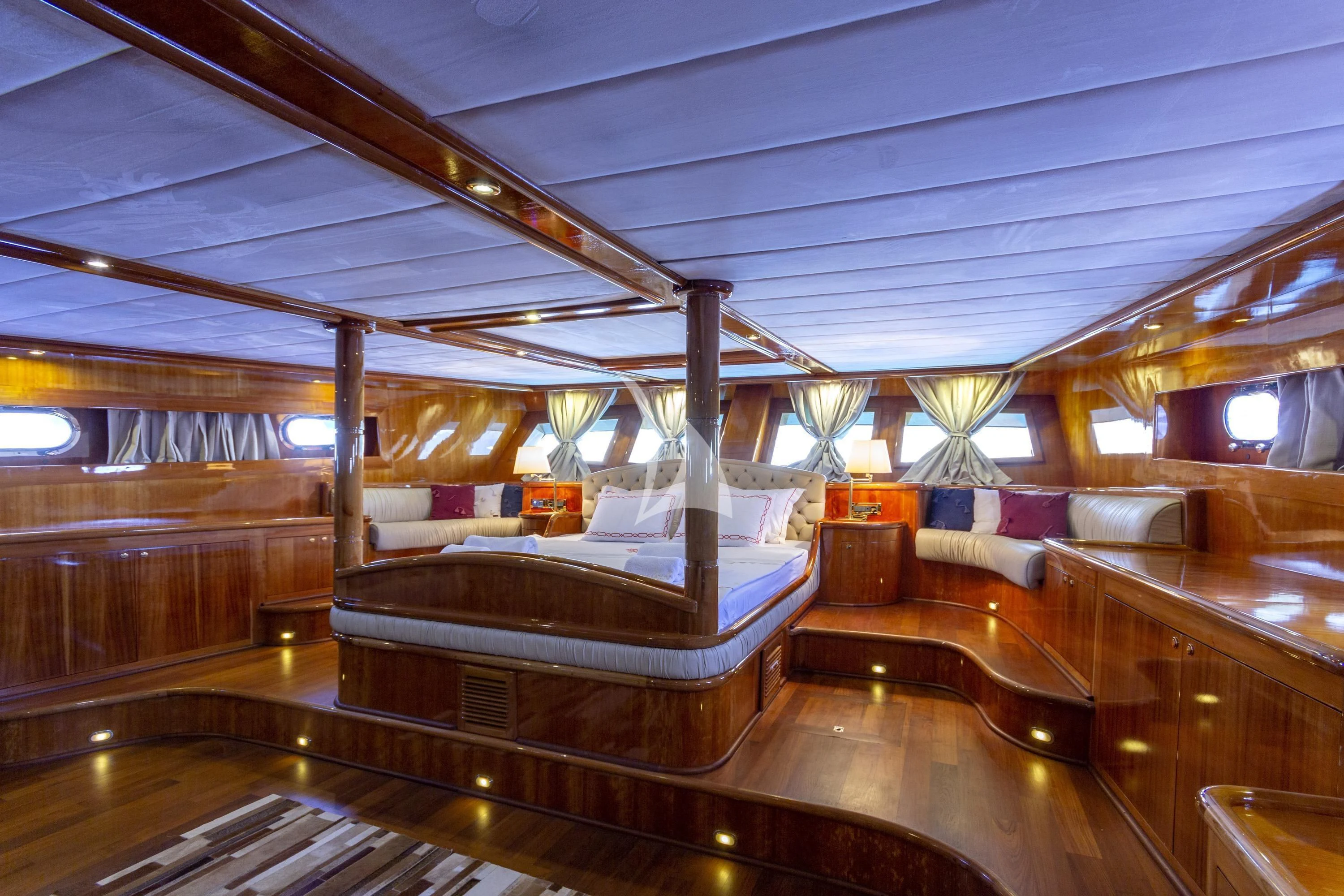 a room with a bed and a bench aboard SILVER MOON Yacht for Sale