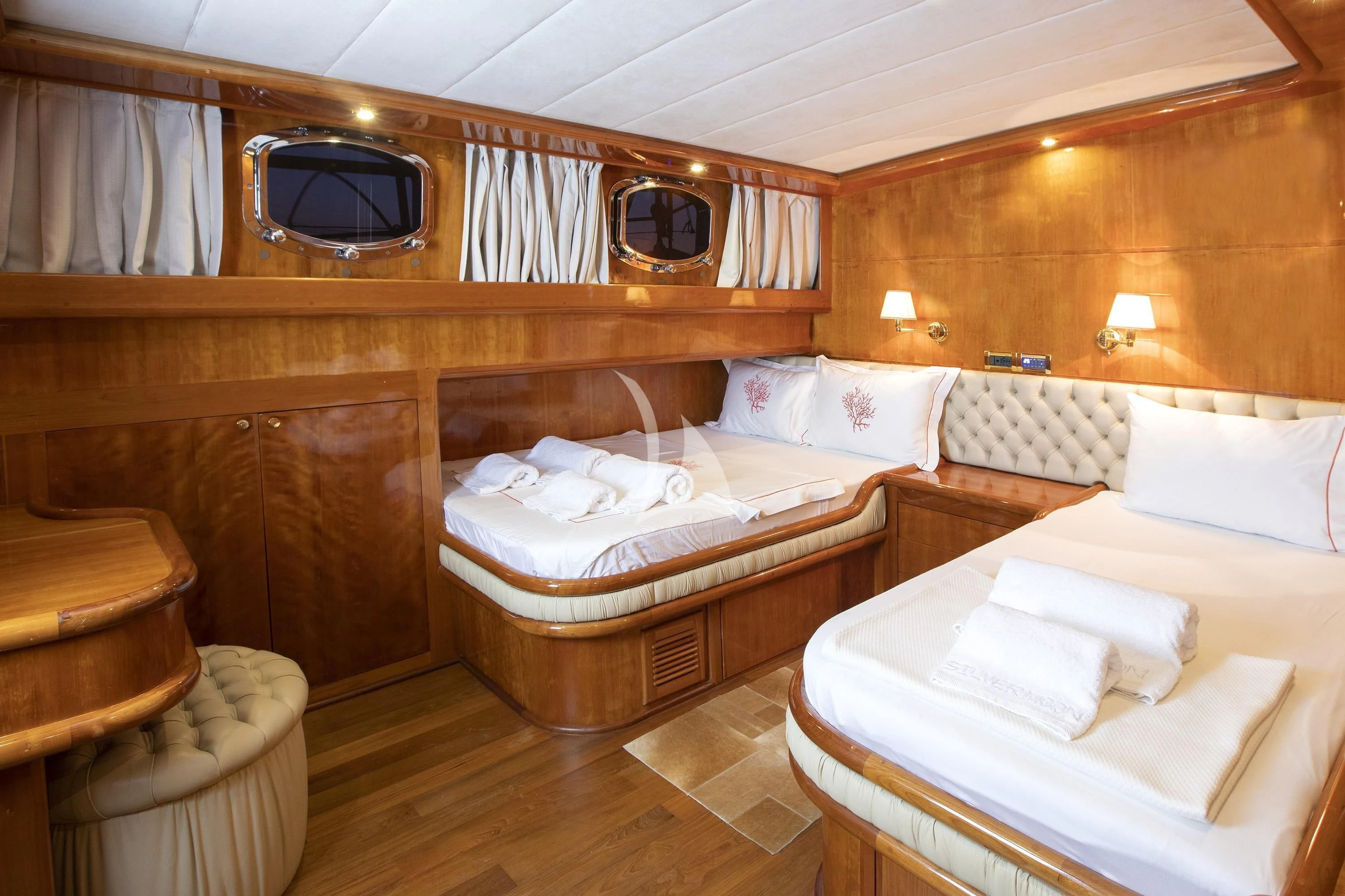 a room with beds and a mirror aboard SILVER MOON Yacht for Sale