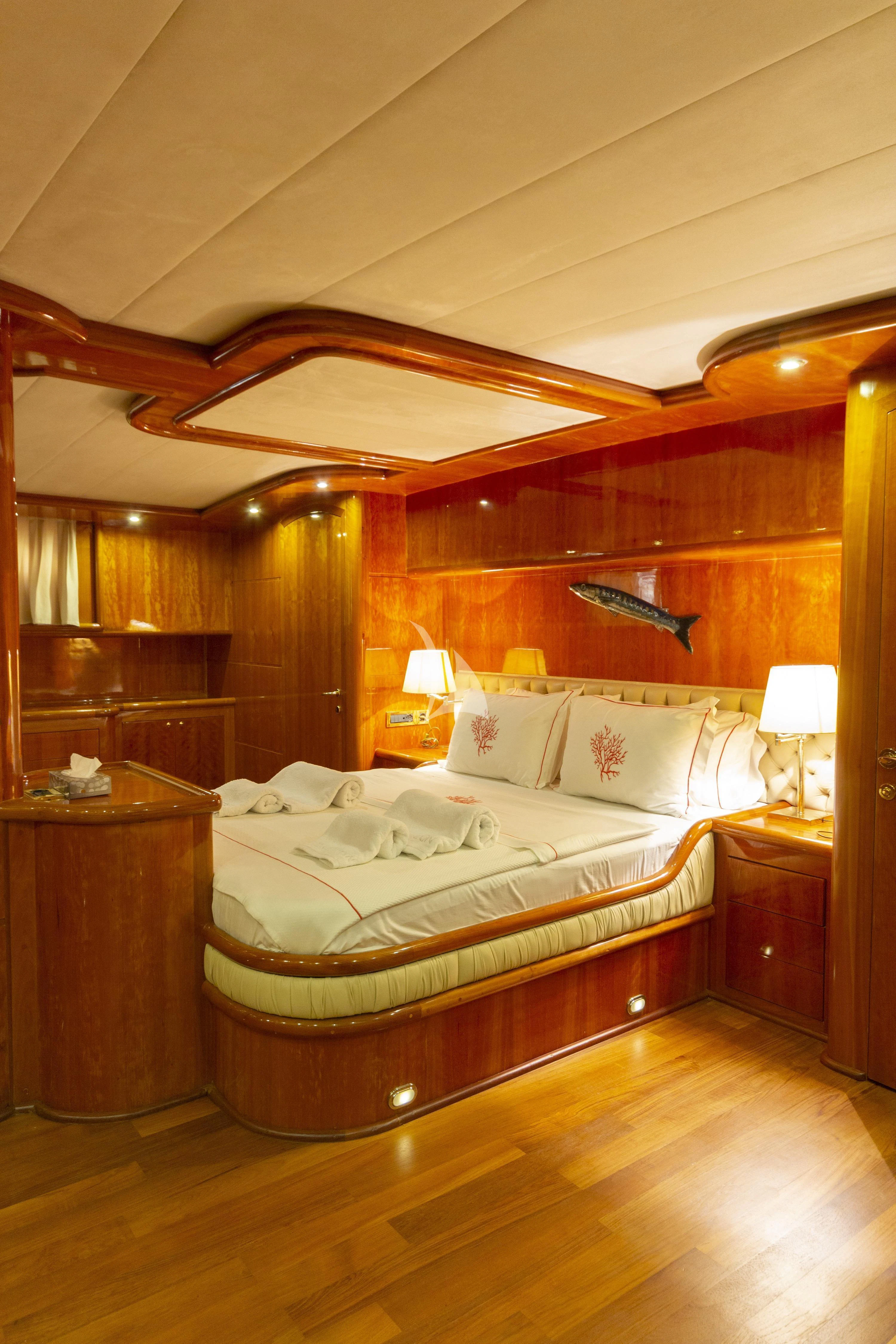 a bedroom with a large bed aboard SILVER MOON Yacht for Sale